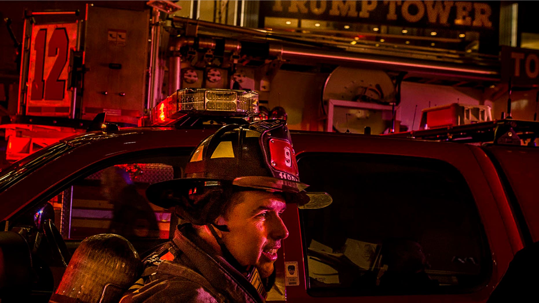 A firefighter works in front of Trump Tower after a fire in New York, April 7, 2018.