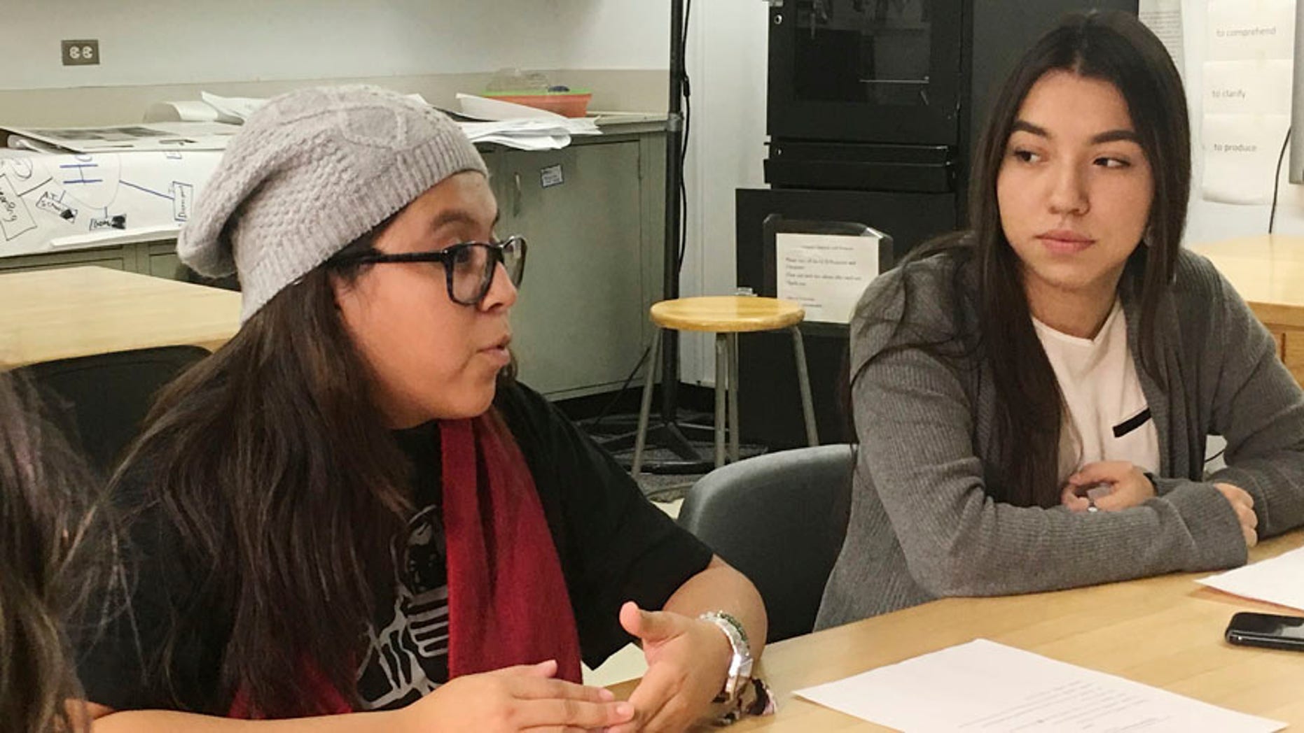 In this photo taken Dec. 1, 2016, Mexican students Yatziri Tovar, left, and Roxanna Herrera, discuss their travel plans at City College of New York.
