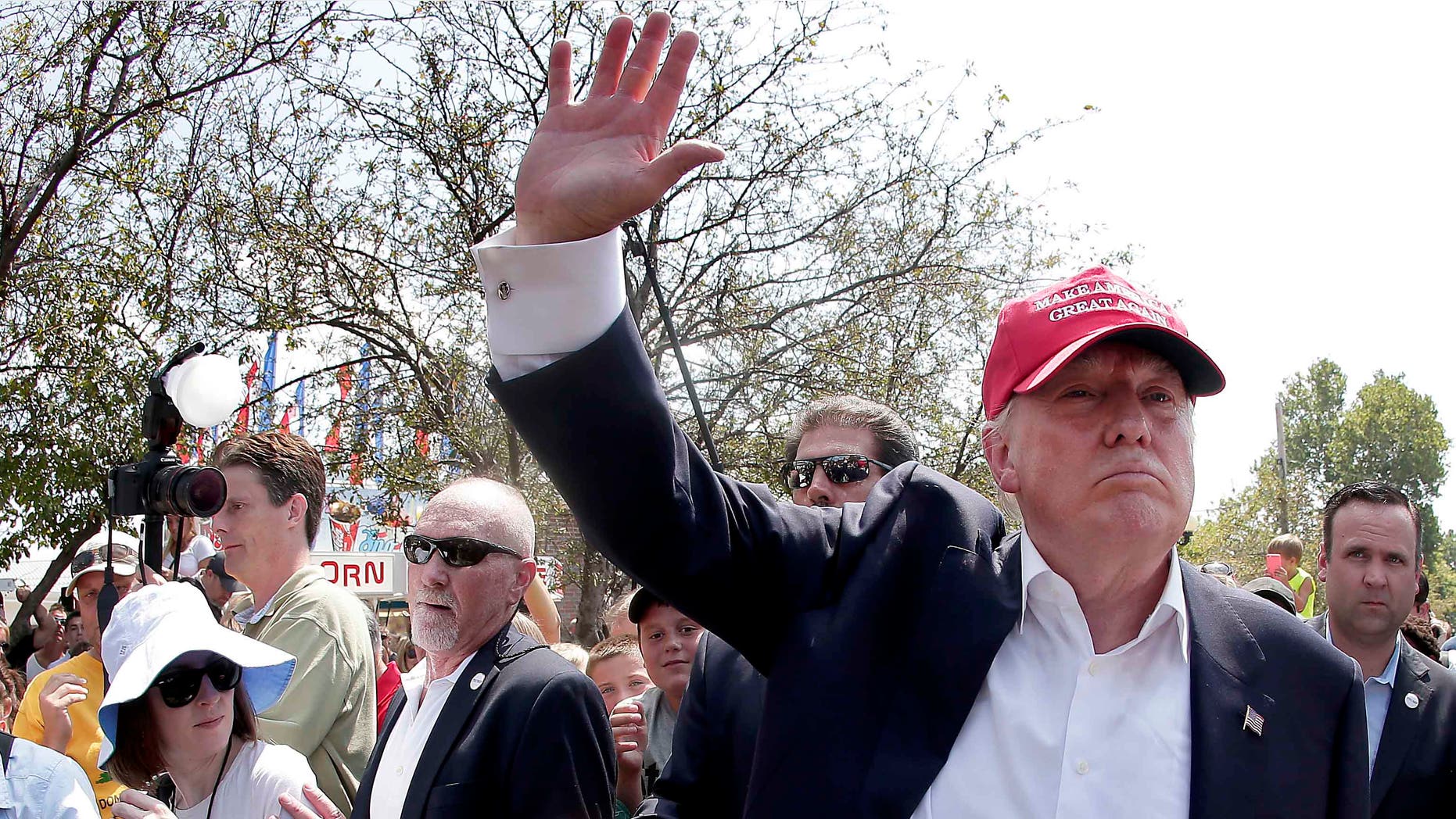 FILE - In this Saturday, Aug. 15, 2015, file photo, Republican presidential candidate Donald Trump waves to the crowd at the Iowa State Fair in Des Moines. Trump wants to deny citizenship to the babies of immigrants living in the U.S. illegally as part of an immigration plan that emphasizes border security and deportation for millions. (AP Photo/Charlie Riedel, File)