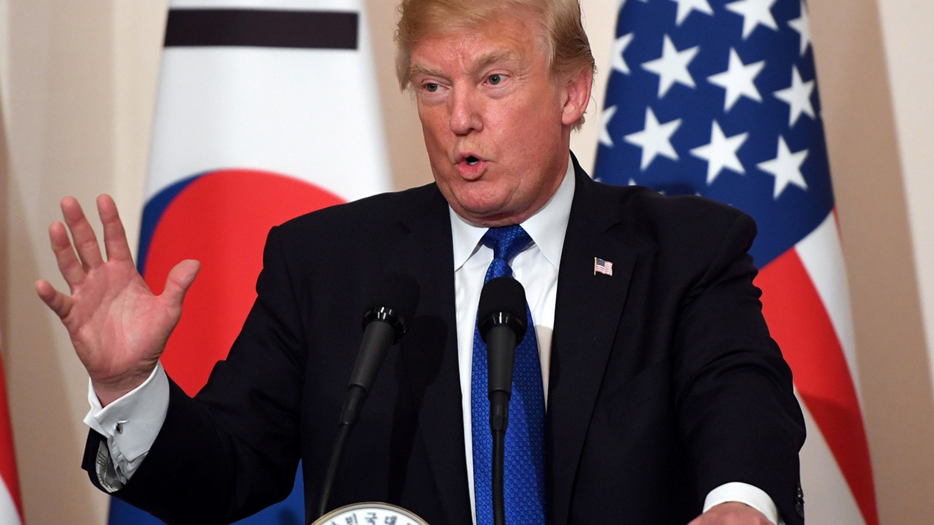 U.S. President Donald Trump gestures as he speaks during a joint press conference with South Korea's President Moon Jae-in (not pictured) at the presidential Blue House in Seoul, South Korea, November 7, 2017. REUTERS/Jung Yeon-Je/Pool - RC13227F9EB0