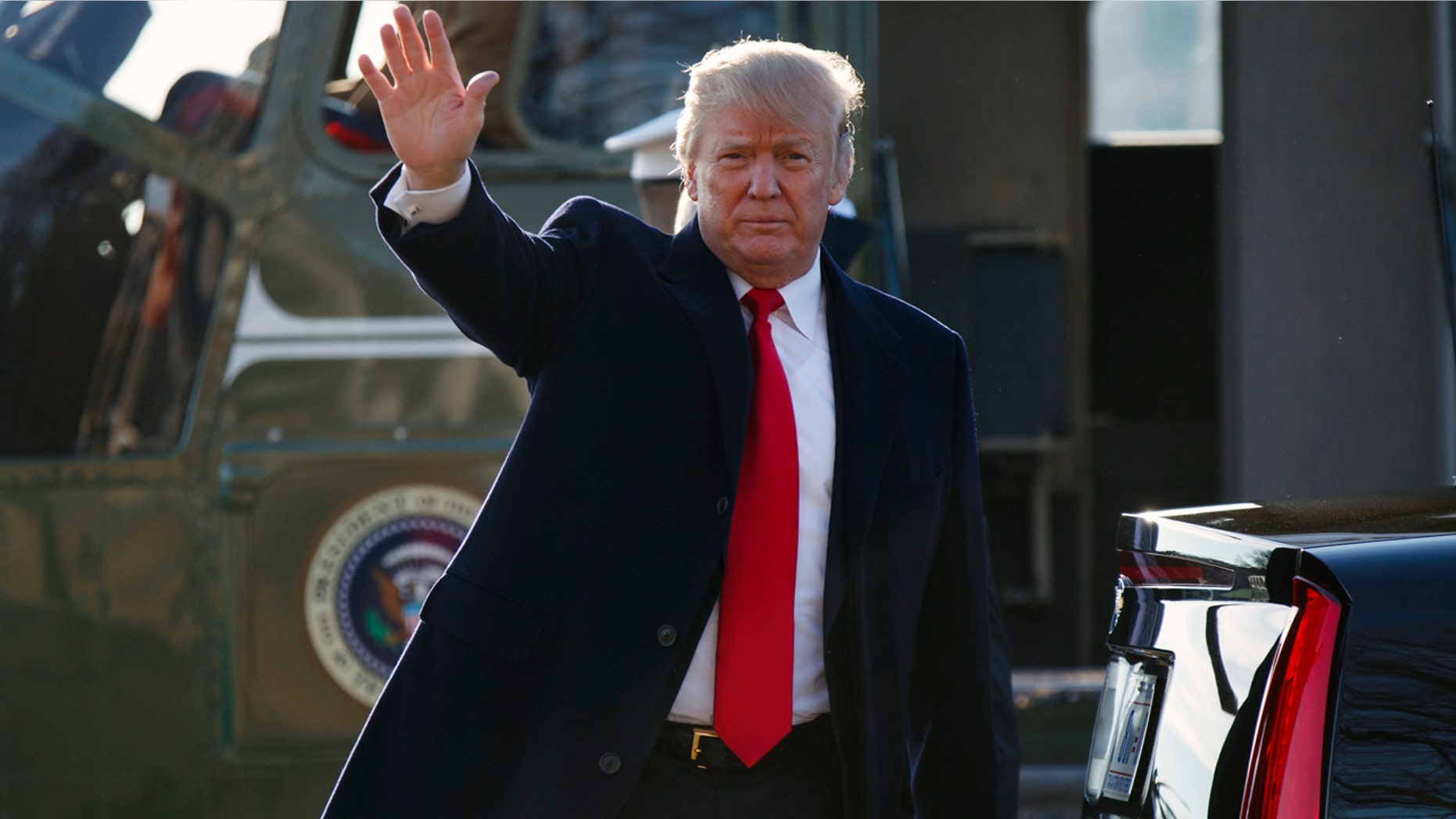 FILE -- Dec. 21, 2017: President Trump steps off Marine One after landing at Walter Reed National Military Medical Center in Bethesda, Md.