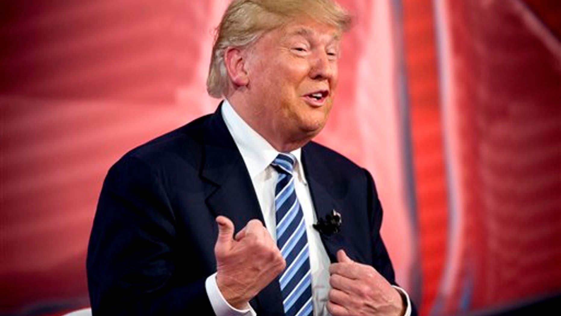 Republican presidential candidate Donald Trump speaks to members of the audience during a commercial break at a CNN town hall at the University of South Carolina in Columbia, S.C., Thursday, Feb. 18, 2016. (AP Photo/Andrew Harnik)