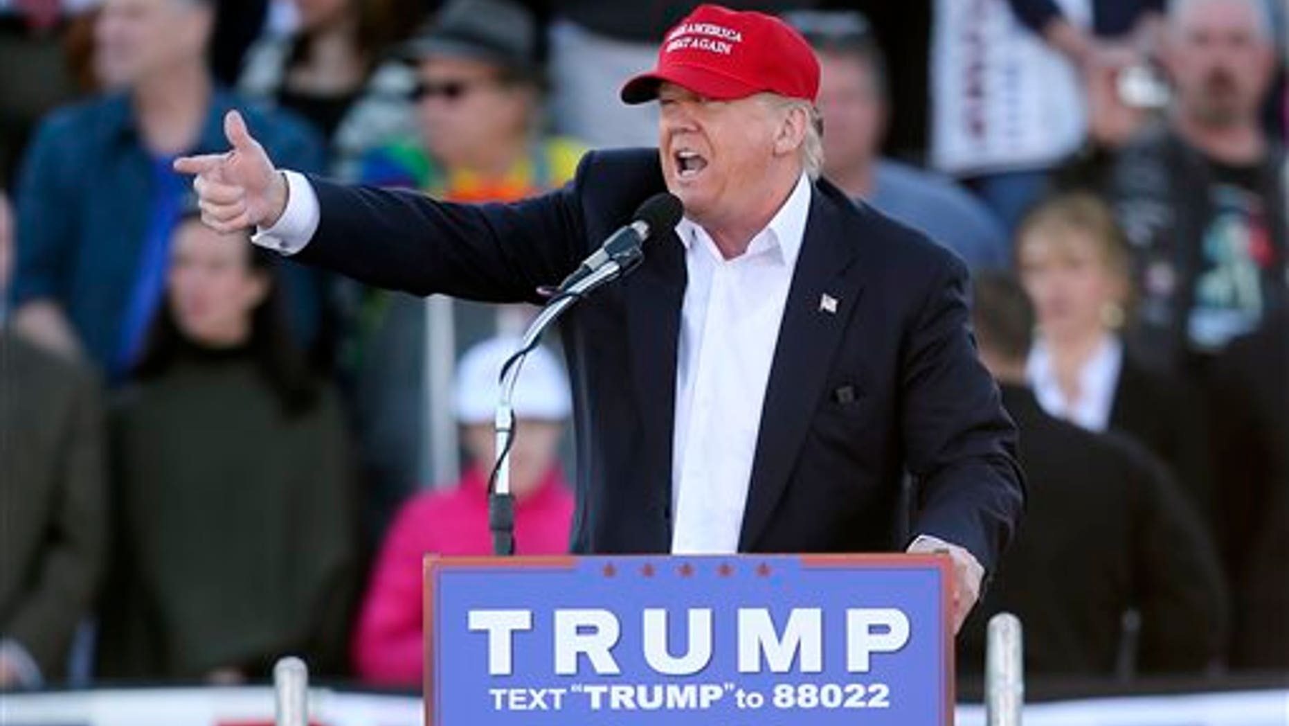 Republican presidential candidate Donald Trump points as he speaks during a rally Sunday, Feb. 28, 2016, in Madison, Ala. (AP Photo/John Bazemore)