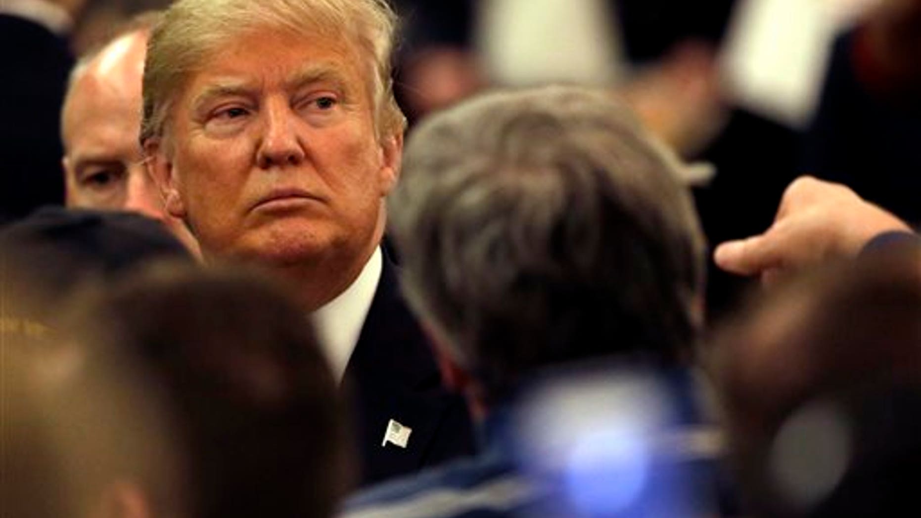 Republican presidential candidate Donald Trump looks to supporters as he leaves a campaign stop Wednesday, March 30, 2016, in Appleton, Wis. (AP Photo/Nam Y. Huh)