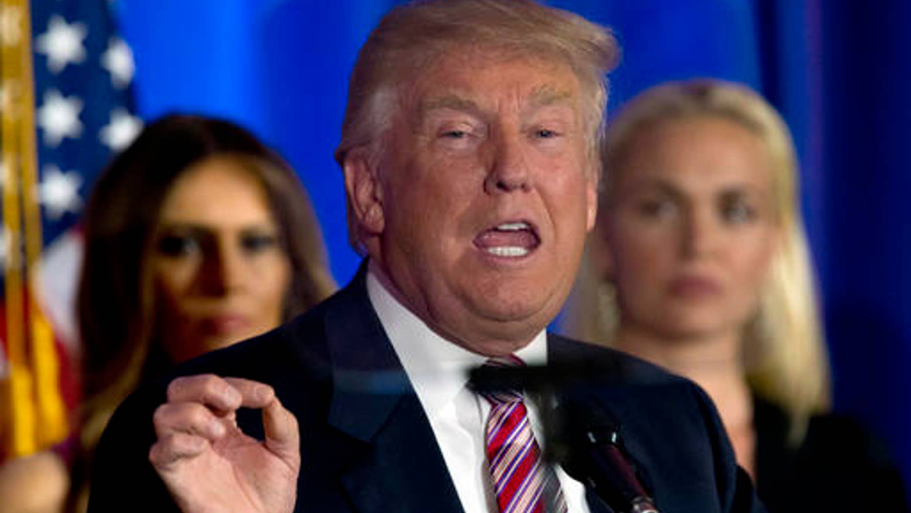 Republican presidential candidate Donald Trump is seen through the teleprompter as he speaks at the Trump National Golf Club Westchester, Tuesday, June 7, 2016, in Briarcliff Manor, N.Y. (AP Photo/Mary Altaffer)