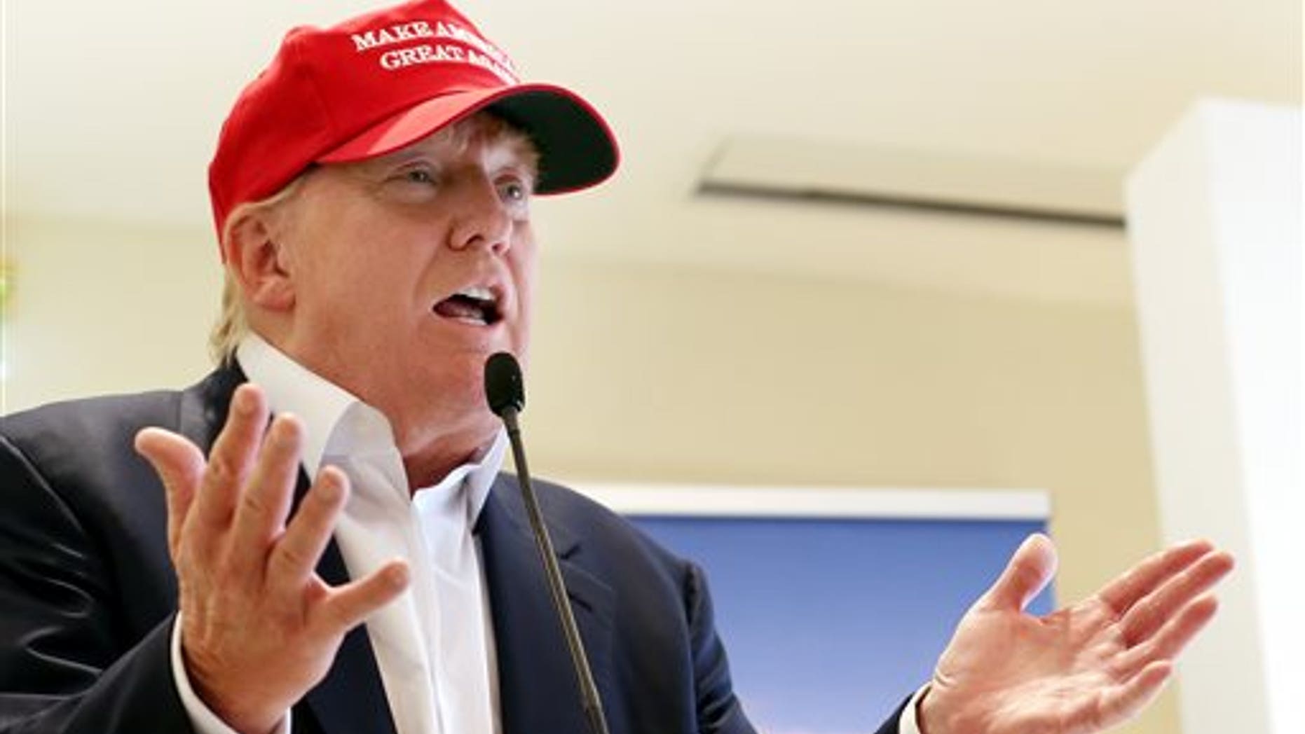 FILE - In this July 30, 2015 file photo, Republican presidential candidate Donald Trump speaks to the media during a news conference on the first day of the Women's British Open golf championship on the Turnberry golf course in Turnberry, Scotland. Republican presidential candidates dismissed Trump's dominance in early primary polling, scrambling to position themselves days before their first debate. (AP Photo/Scott Heppell, File)