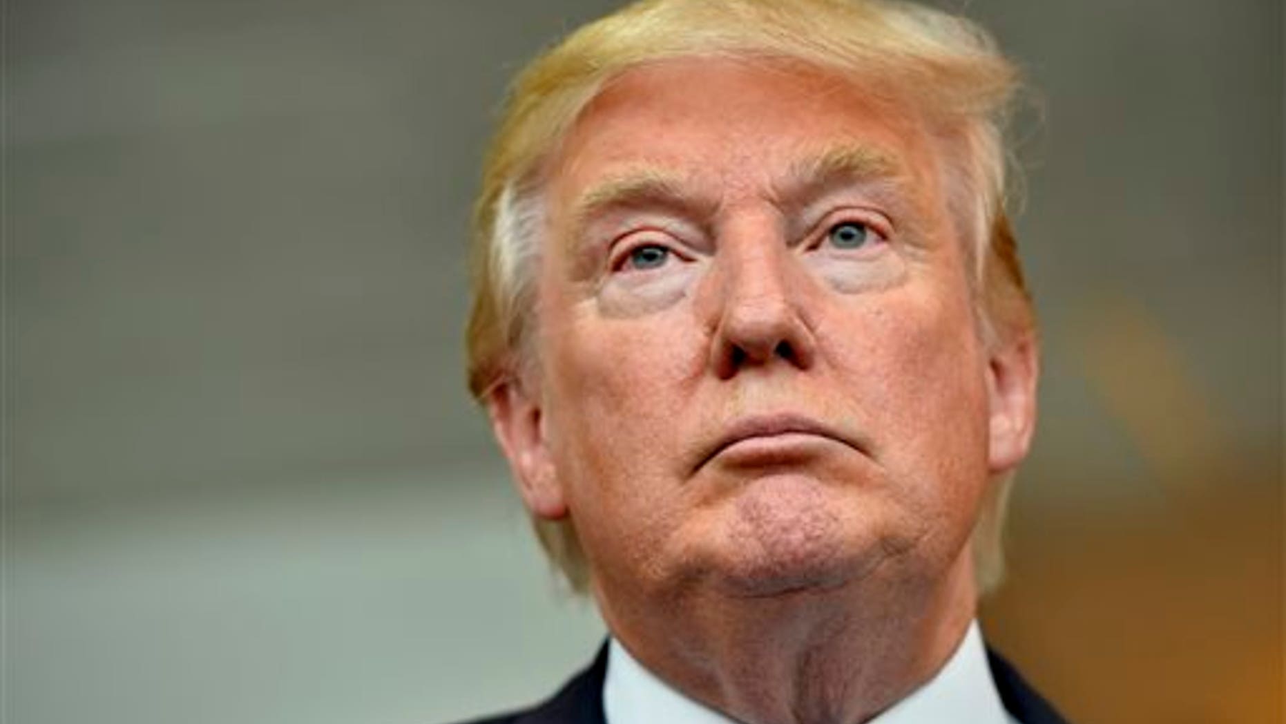 Republican presidential candidate Donald Trump listens during a news conference after speaking at the TD Convention Center, Thursday, Aug. 27, 2015, in Greenville, S.C. (AP Photo/Richard Shiro)