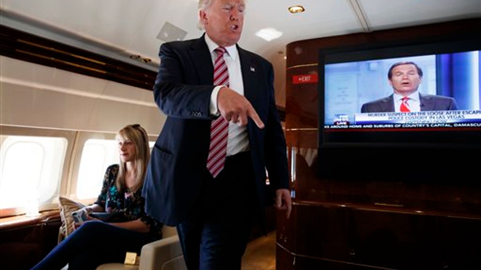 Republican presidential candidate Donald Trump on his campaign plane, September 5, 2016.