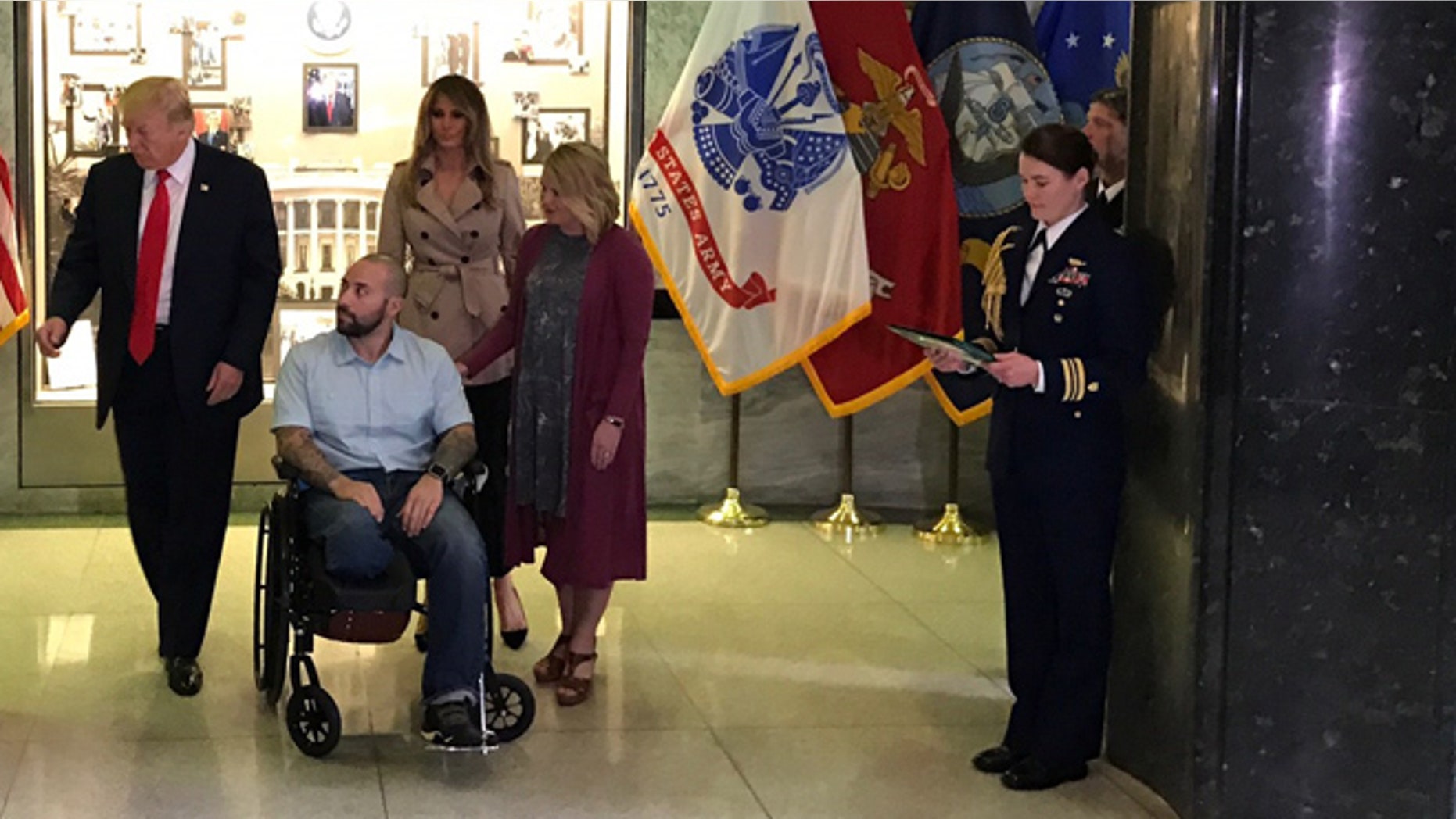 April 22, 2017: Donald Trump presents Purple Heart award to Army Sgt. Alvaro Barrietos. First lady Melania Trump and wife Tammy Barrietos are behind, to Barrietos’ left. Walter Reed National Medical Center, Bethesda, Md. (White House submitted photo.)