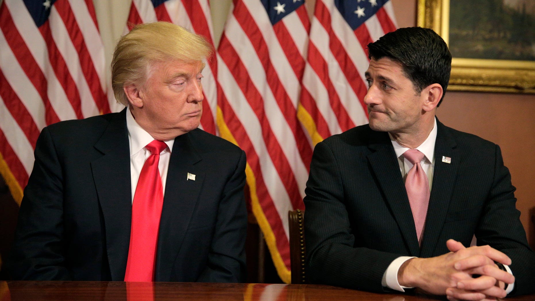 FILE -- November 10, 2016: U.S. President-elect Donald Trump (L) meets with Speaker of the House Paul Ryan (R-WI) on Capitol Hill in Washington.