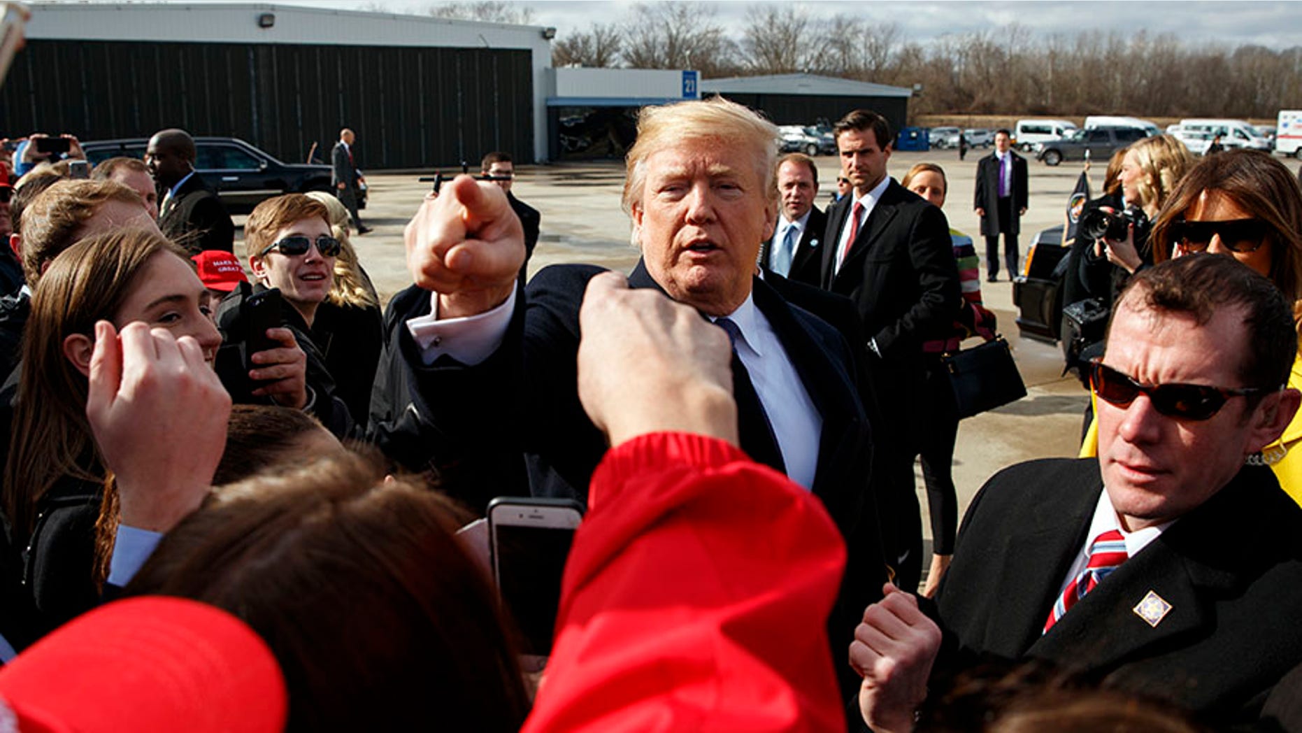 President Donald Trump greets supporters after arriving at Cincinnati Municipal Lunken Airport, Monday, Feb. 5, 2018, in Cincinnati. (AP Photo/Evan Vucci)