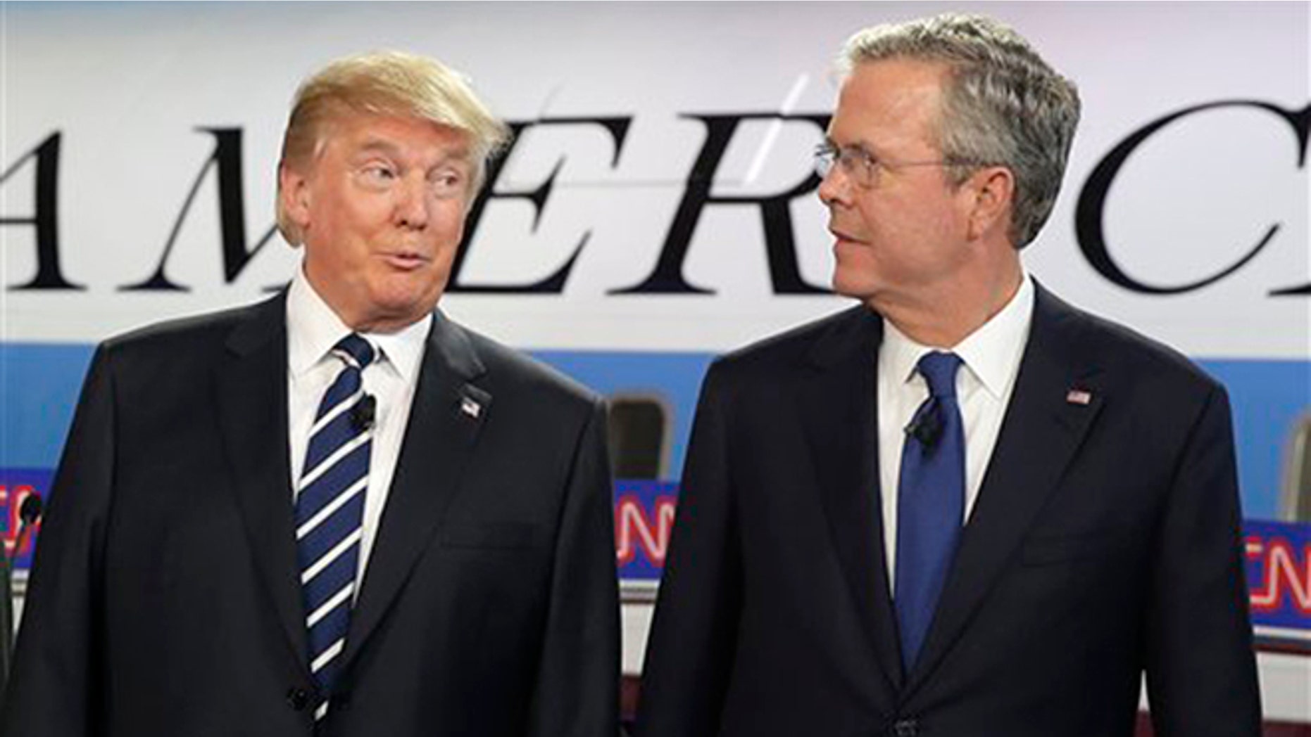 Republican presidential candidates, businessman Donald Trump, left, and former Florida Gov. Jeb Bush talk together before the start of the CNN Republican presidential debate at the Ronald Reagan Presidential Library and Museum on Wednesday, Sept. 16, 2015, in Simi Valley, Calif. (AP Photo/Chris Carlson)