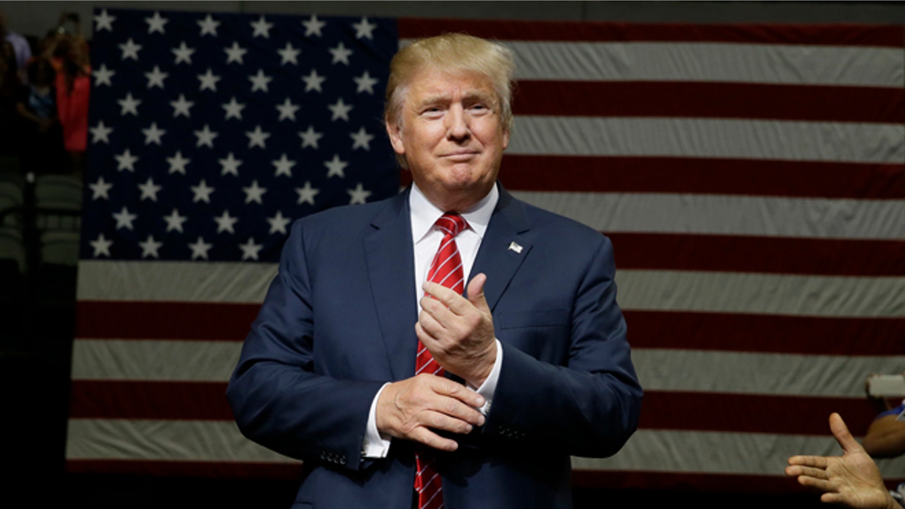 Republican presidential candidate Donald Trump speaks to supporters as he takes the stage for a campaign event in Dallas, Monday, Sept. 14, 2015. (AP Photo/LM Otero)