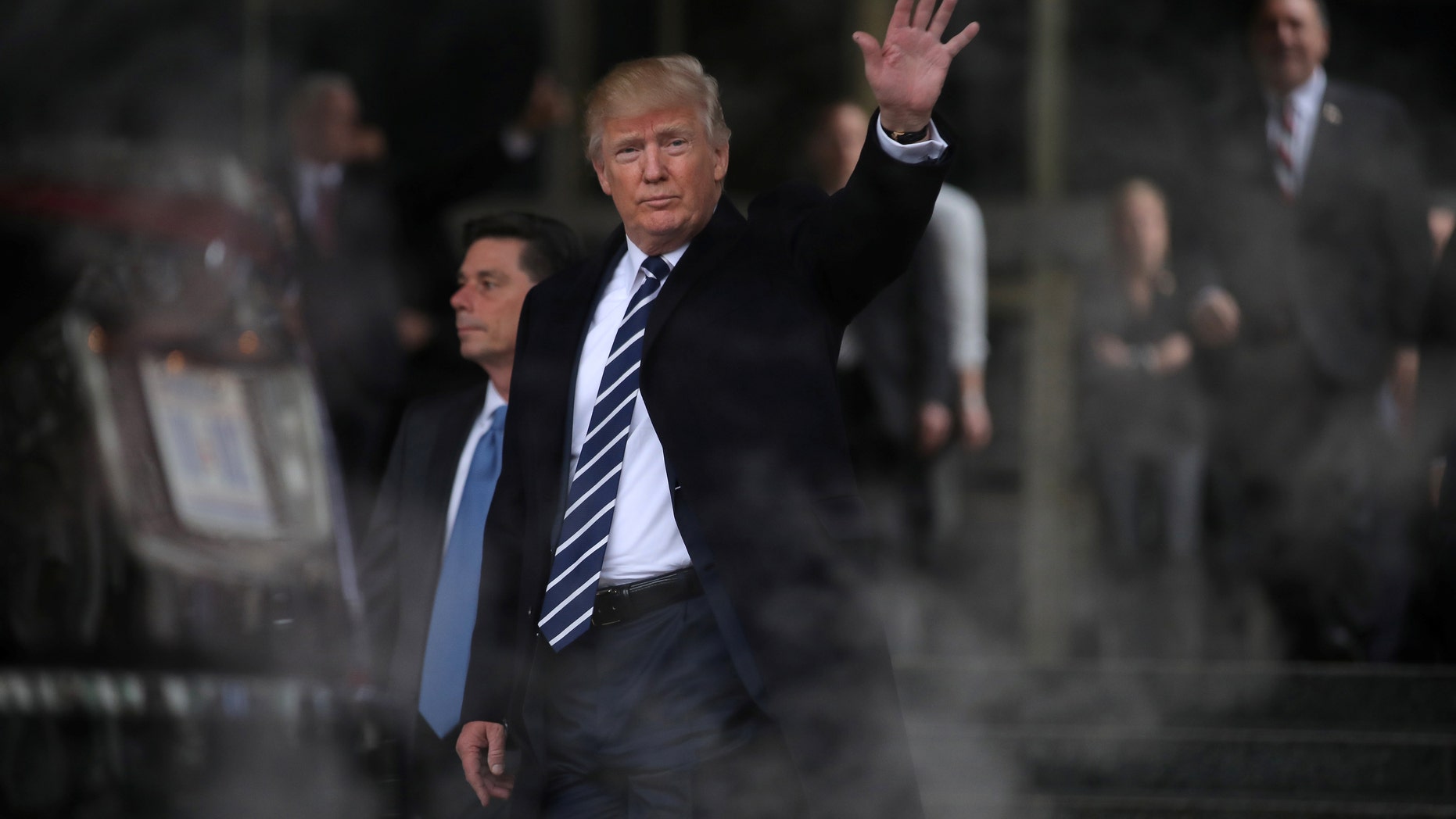 File photo - U.S. President Donald Trump waves as he leaves the Central Intelligence Agency (CIA) headquarters after delivering remarks during a visit in Langley, Virginia U.S., January 21, 2017. (REUTERS/Carlos Barria)