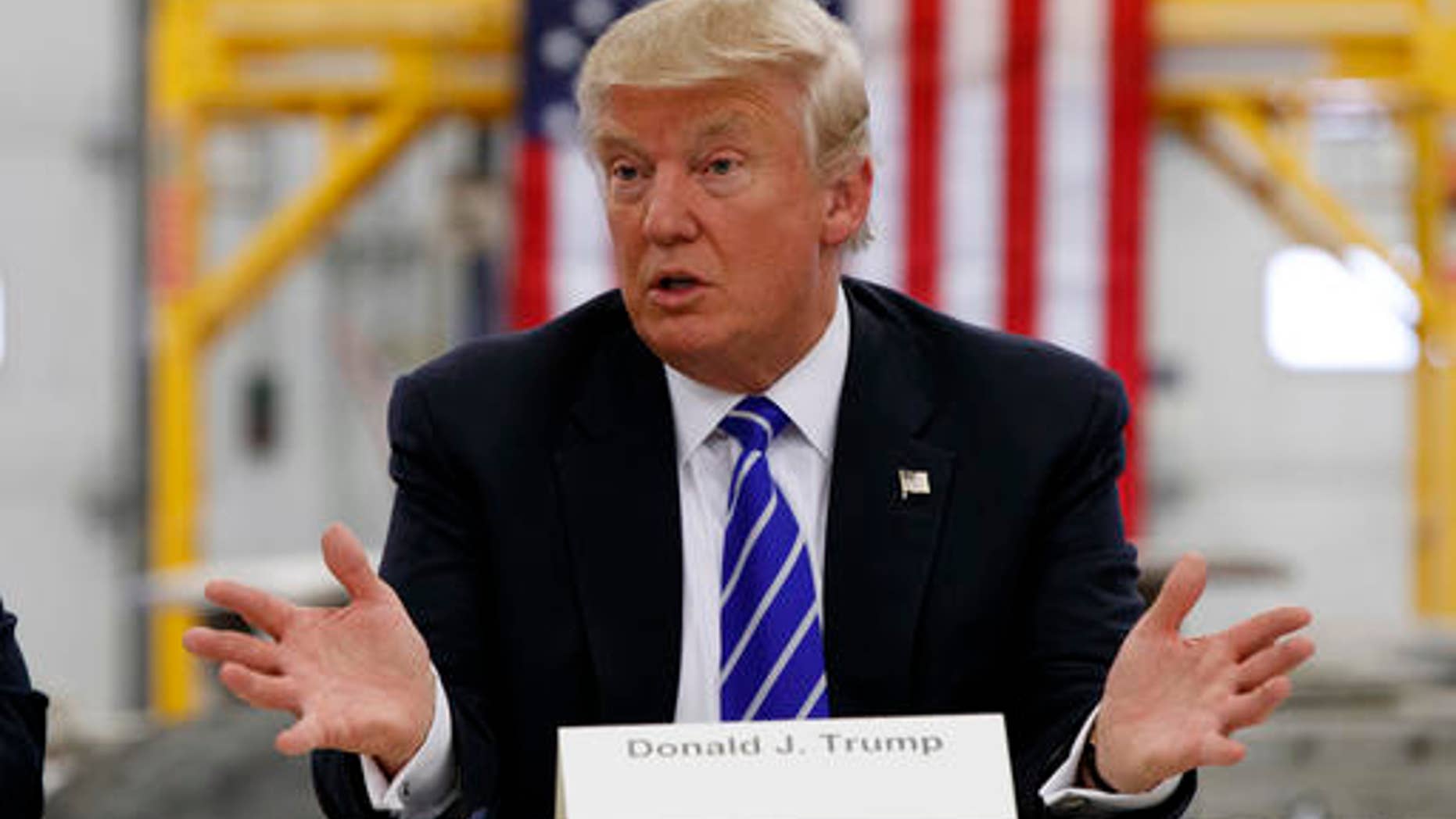 In this Aug. 10, 2016, photo, Republican presidential candidate Donald Trump speaks during a coal mining roundtable at Fitzgerald Peterbilt in Glade Spring, Va. (AP Photo/Evan Vucci)