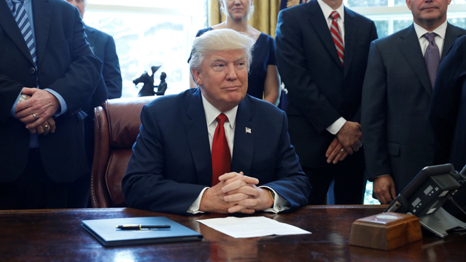 President Trump's alleged Coke button is pictured in the lower right corner of the photograph.