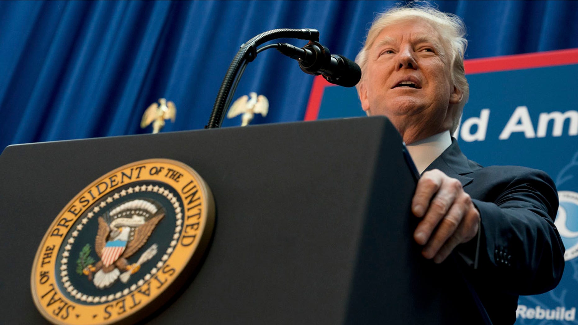 In this Friday, June 9, 2017, photo, President Donald Trump speaks on infrastructure at the Department of Transportation in Washington. Trump is expected to outline his new policy with Cuba next week, announcing steps that could reverse some of the changes made by former President Barack Obama to open commerce and travel after a half-century standoff with the communist island. (AP Photo/Andrew Harnik)
