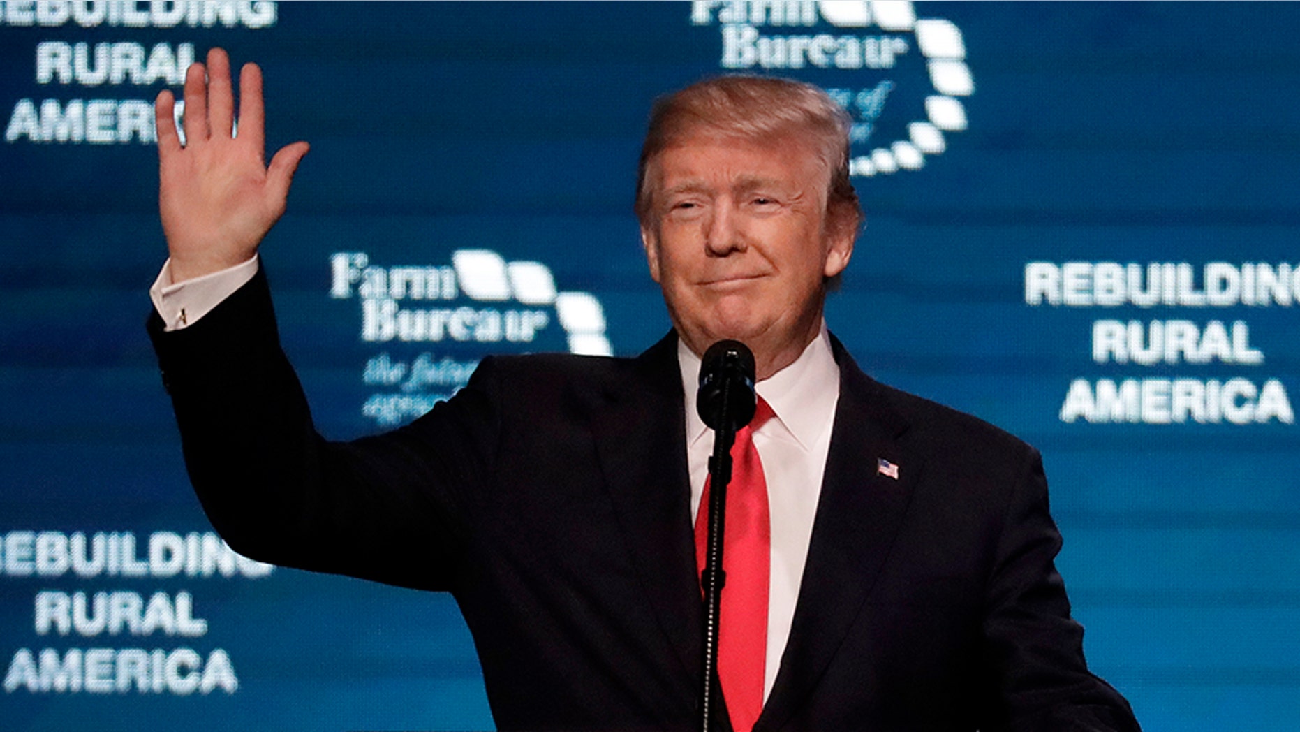 President Donald Trump waves as he speaks at the American Farm Bureau Federation annual convention Monday, Jan. 8, 2018, in Nashville, Tenn.
