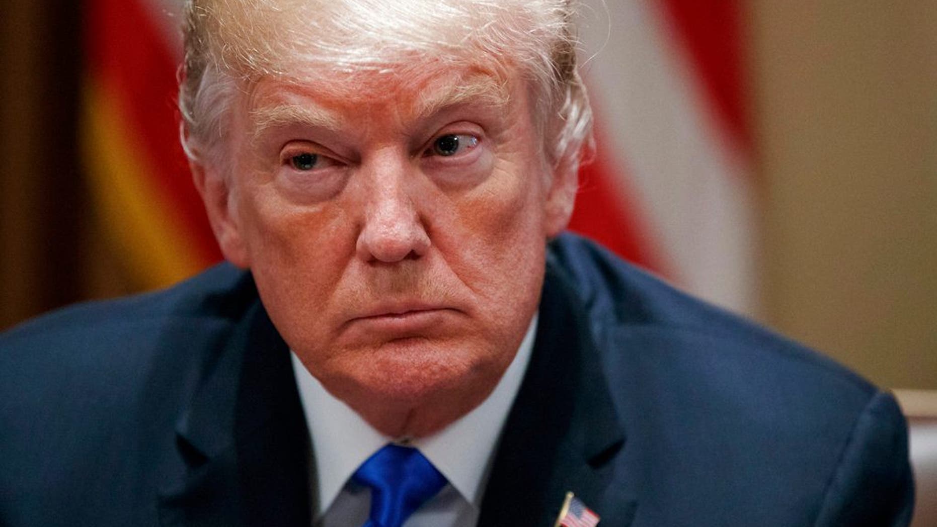 In this Feb. 28, 2018 photo, President Donald Trump pauses during a meeting in the Cabinet Room of the White House, in Washington, with members of congress to discuss school and community safety. A White House official says President Donald Trump plans to announce Thursday whether he'll impose tariffs or quotas on steel and aluminum imports. (AP Photo/Carolyn Kaster)
