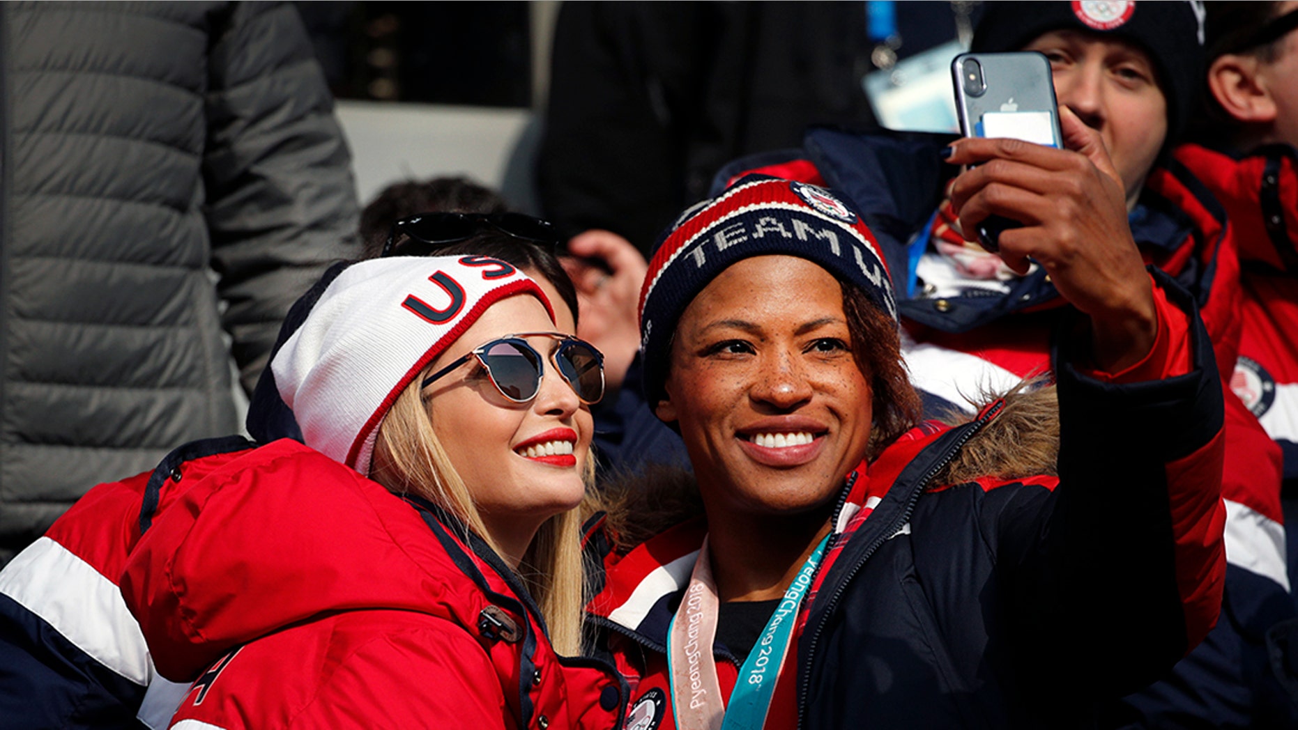 Lauren Gibbs takes a selfie with Ivanka Trump during the final day of competition at the Winter Olympics Sunday.