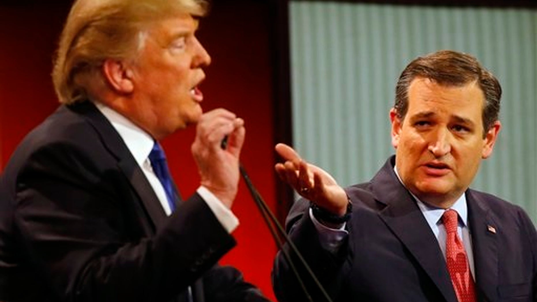 Republican presidential candidates, businessman Donald Trump and Sen. Ted Cruz, R-Texas, argue a point during a Republican presidential primary debate at Fox Theatre, Thursday, March 3, 2016, in Detroit. (AP Photo/Paul Sancya)