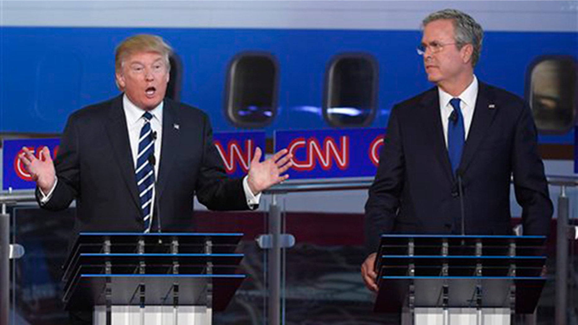 Republican presidential candidate, businessman Donald Trump, left, speaks as Jeb Bush looks on during the CNN Republican presidential debate at the Ronald Reagan Presidential Library and Museum on Wednesday, Sept. 16, 2015, in Simi Valley, Calif. (AP Photo/Mark J. Terrill)