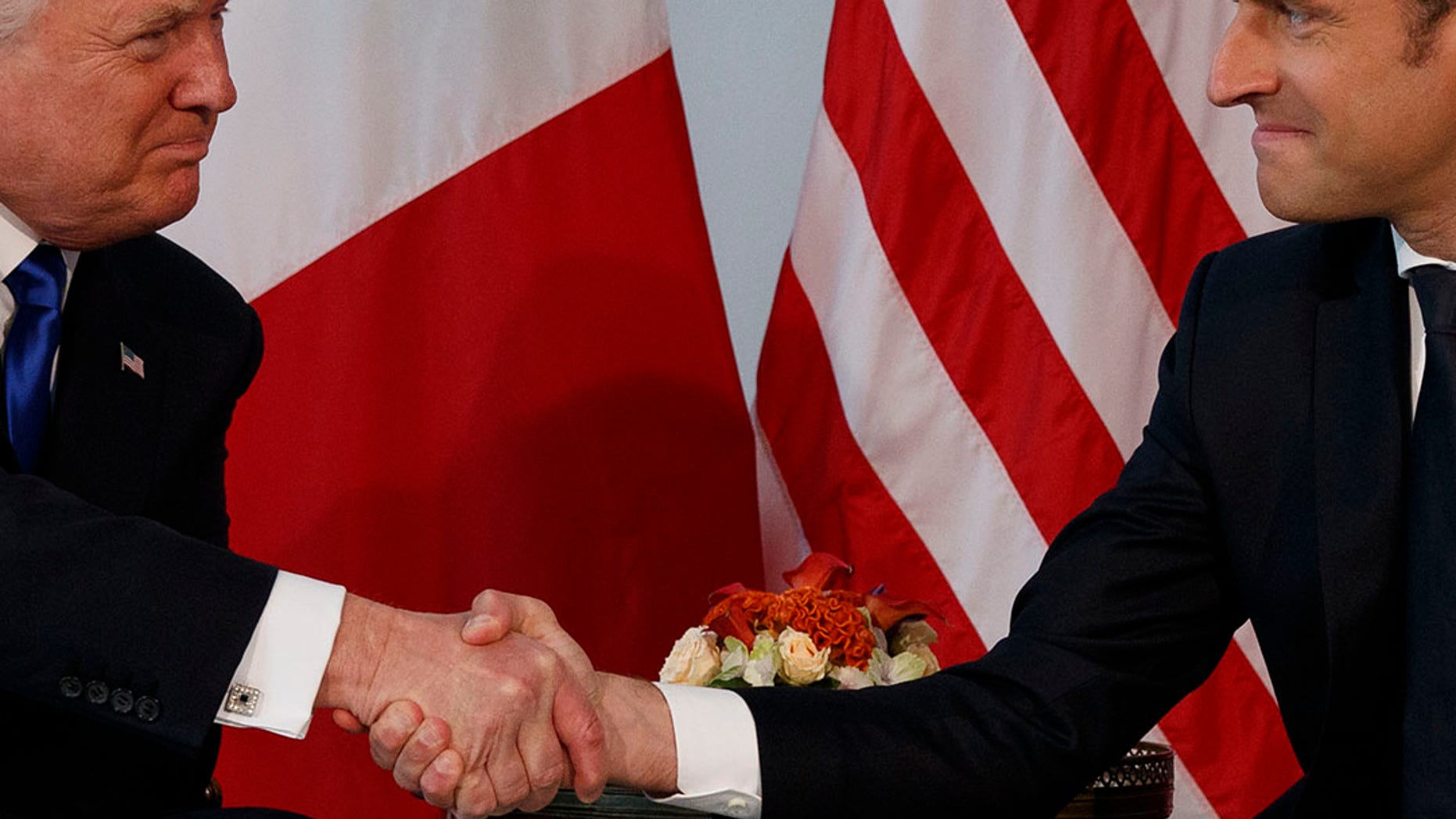 May 25, 2017: President Donald Trump shakes hands with French President Emmanuel Macron during a meeting at the U.S. Embassy in Brussels