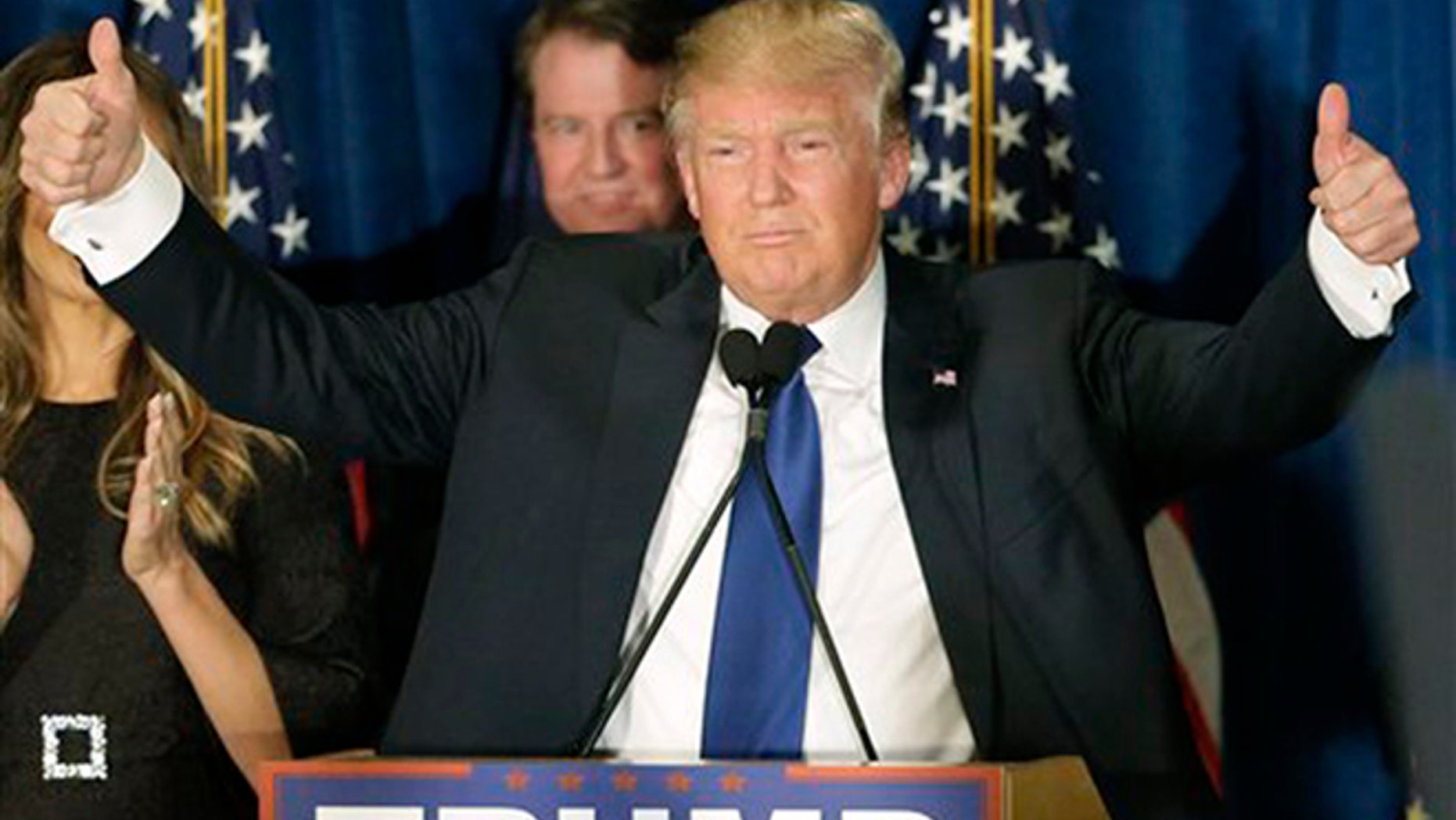 Republican presidential candidate, businessman Donald Trump gives thumbs up to supporters during a primary night rally, Tuesday, Feb. 9, 2016, in Manchester, N.H. (AP Photo/David Goldman)