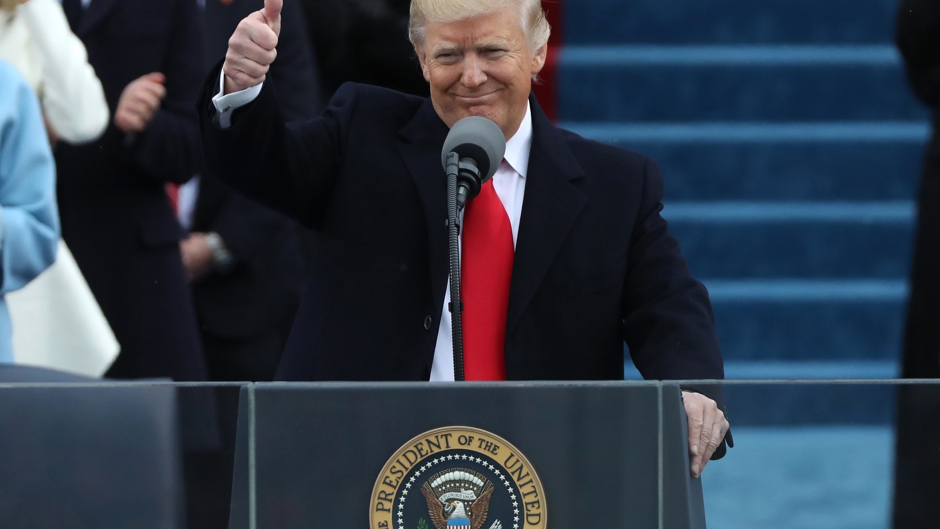 U.S. President Donald Trump gives a thumbs up after being sworn in as the 45th president of the United States on the West front of the U.S. Capitol in Washington, U.S., Jan. 20, 2017. (REUTERS/Carlos Barria)