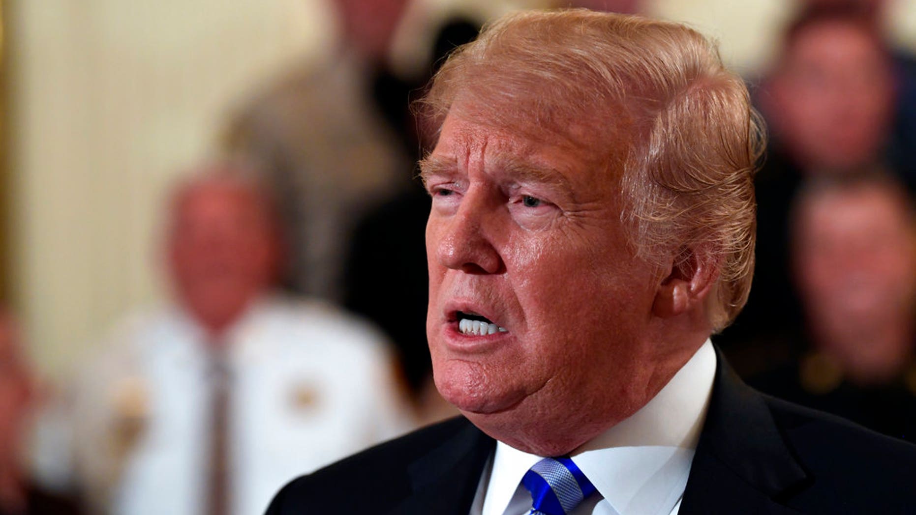 President Donald Trump responds to a reporters question during an event with sheriffs in the East Room of the White House in Washington, Wednesday, Sept. 5, 2018. (AP Photo/Susan Walsh)