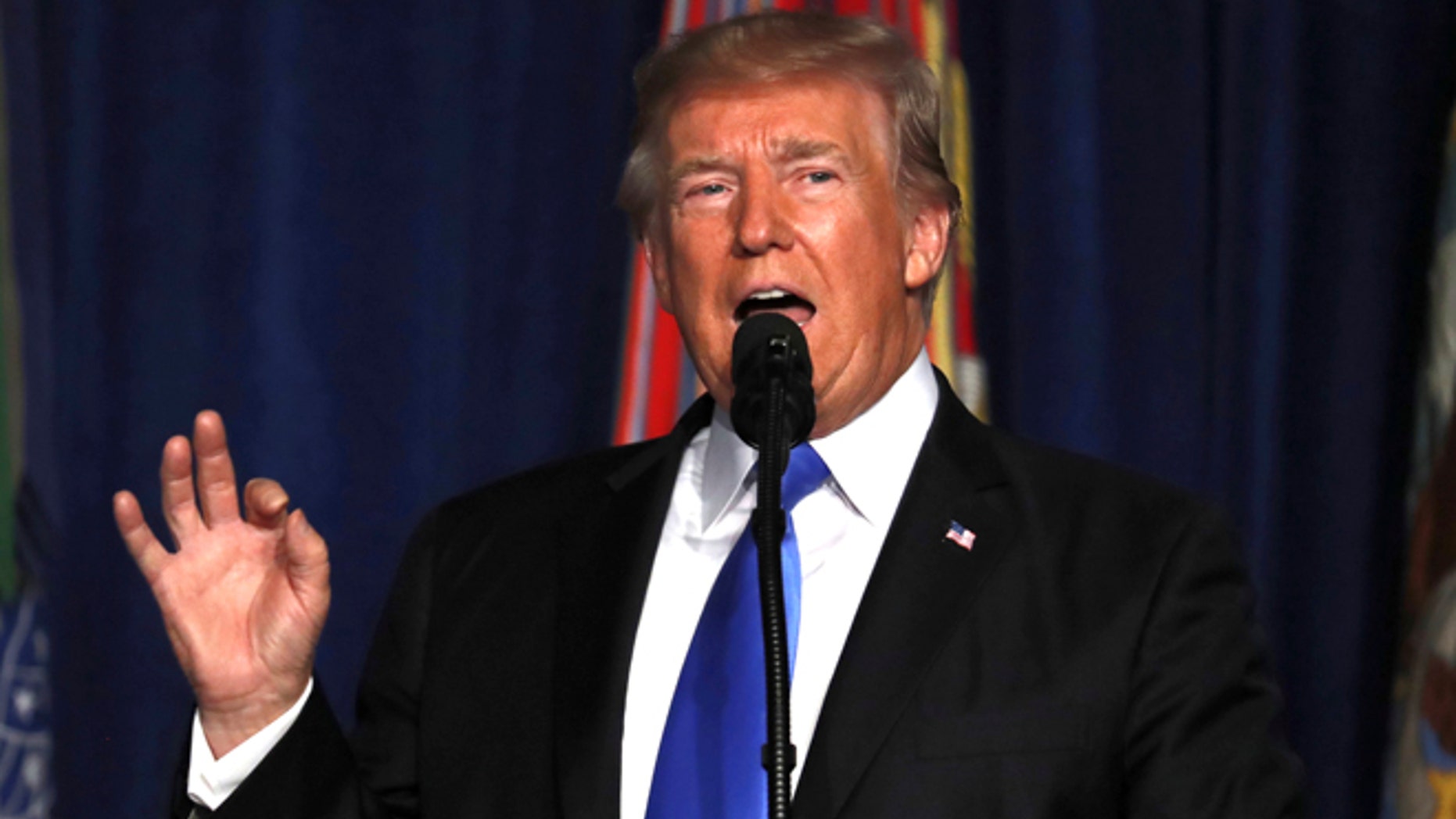 President Donald Trump speaks at Fort Myer in Arlington Va., Monday, Aug. 21, 2017, during a Presidential Address to the Nation about a strategy he believes will best position the U.S. to eventually declare victory in Afghanistan. (AP Photo/Carolyn Kaster)