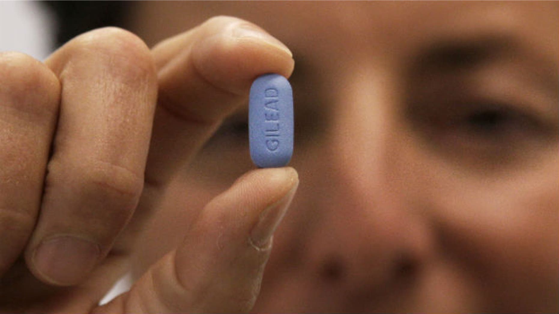 In this May 10, 2012 file photo, Dr. Lisa Sterman holds up a Truvada pill, an HIV treatment pill used to prevent infection in people at high risk of getting the AIDS virus. (AP Photo/Jeff Chiu, File)