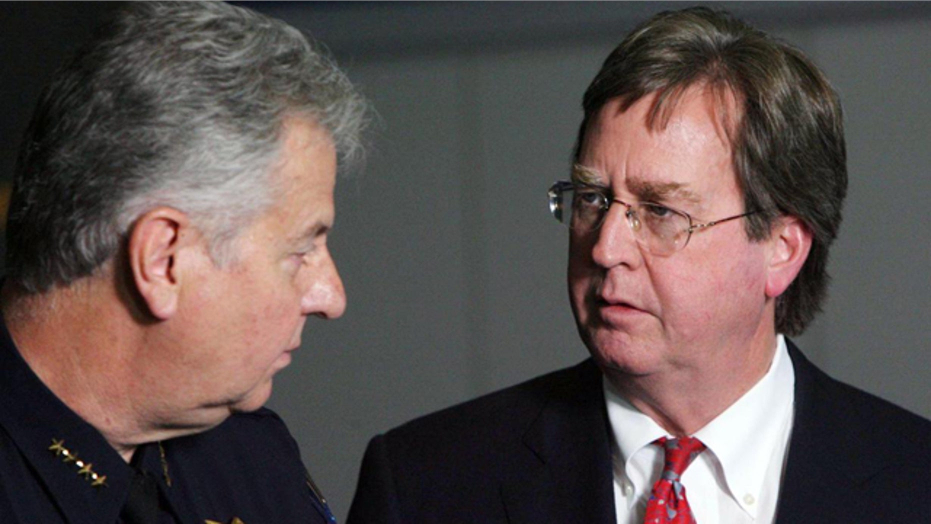 April 7, 2012: Tulsa Mayor Dewey Bartlett, right, chats with Tulsa Chief of Police Chuck Jordan during a news conference at the Tulsa Police Department in downtown Tulsa, Okla.
