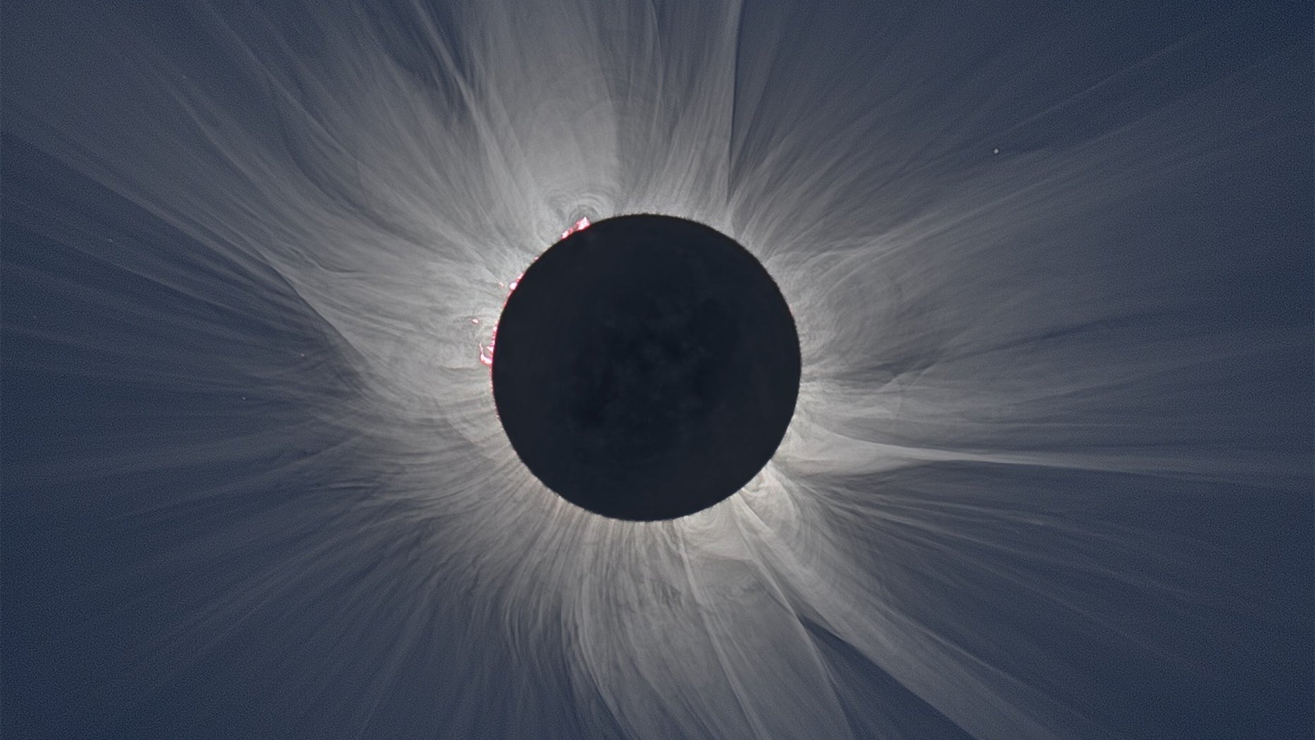 This image is a composite of multiple photographs, and shows the "streamers" in the sun's atmosphere that are visible to the naked eye during a total solar eclipse.