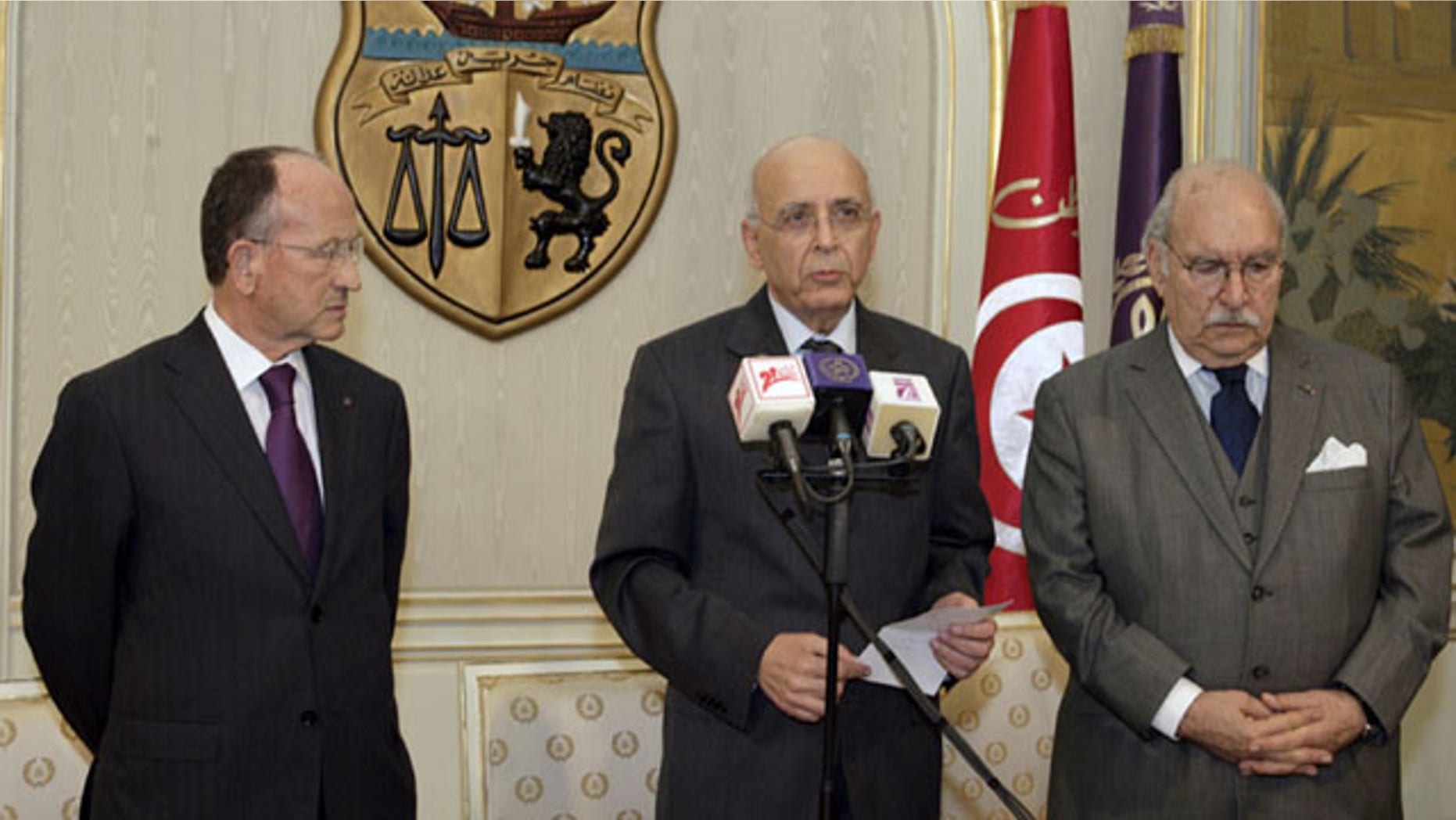 Jan. 14: Prime Minister of Tunisia, Mohammed Ghannouchi, center, before he addressed the nation to announce that he is assuming power in Tunisia.