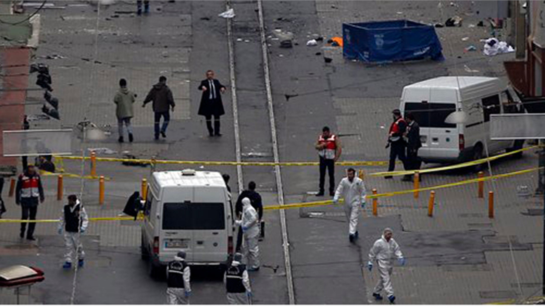 Emergency services attend the scene of an explosion on a street in Istanbul, Turkey, Saturday, March 19, 2016. (AP Photo/Emrah Gurel)