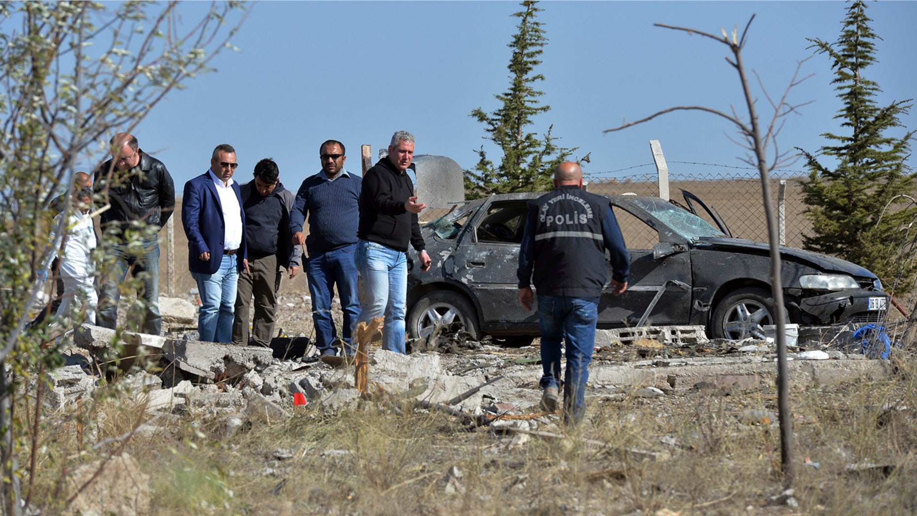 Oct. 8, 2016: Police forensic officers work at the scene after suicide bombers blew themselves up in Haymana in the outskirts of the capital Ankara, Turkey.