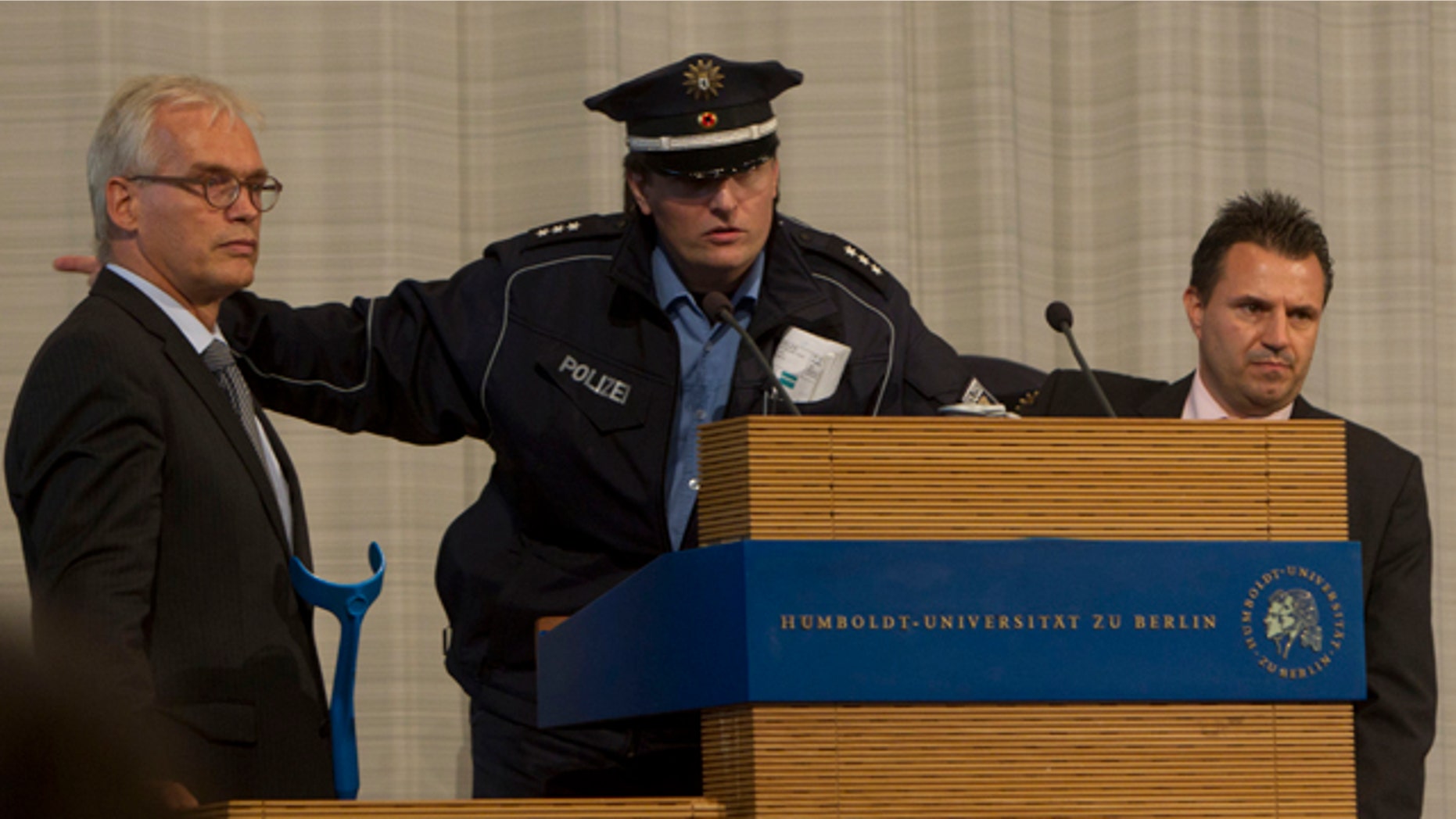 Sept. 19: A police officer calls for an immediate evacuation of the main hall of the Humboldt University minutes prior to a speech of Turkish President Abdullah Gul in Berlin.