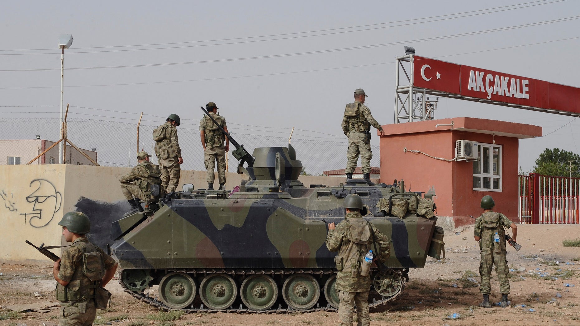 Oct. 7, 2012.: Turkish military station at the border gate with Syria, across from Syrian rebel-controlled Tel Abyad town, in Akcakale, Turkey.