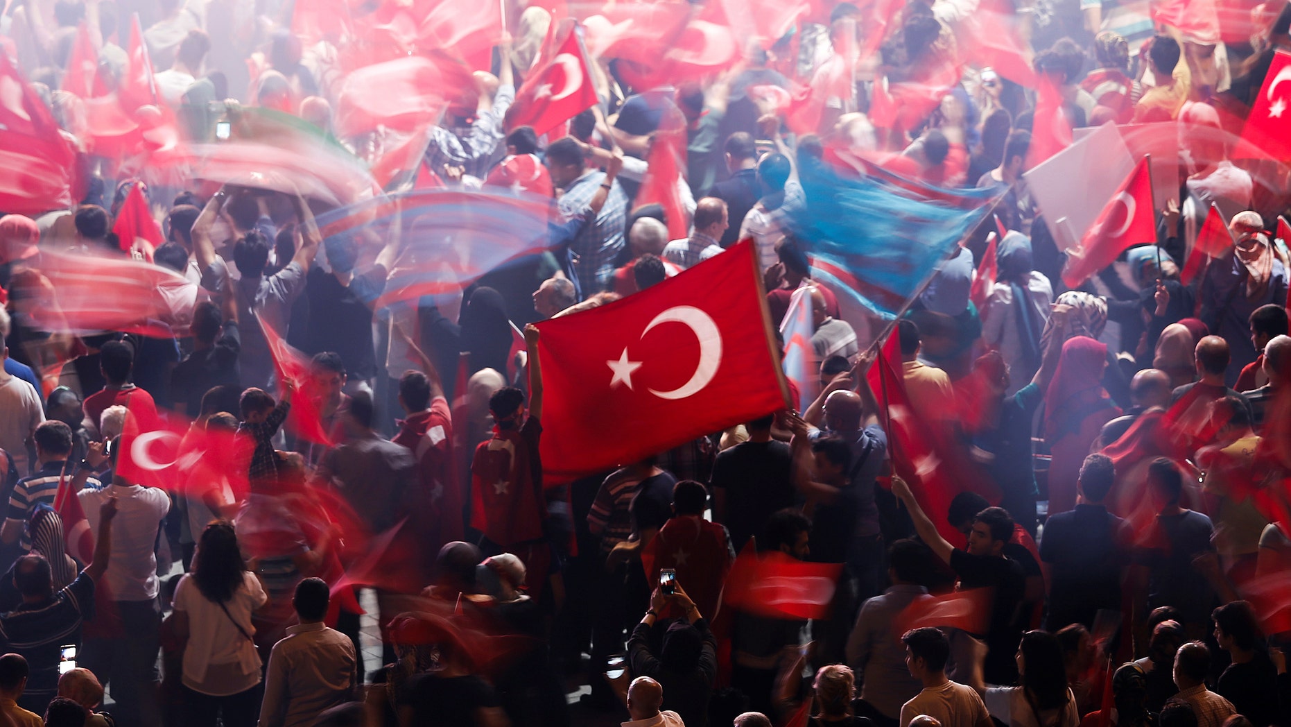 File photo - Supporters of Turkish President Tayyip Erdogan wave Turkish national flags during a pro-government demonstration on Taksim square in Istanbul, Turkey, July 19, 2016. (REUTERS/Alkis Konstantinidis)