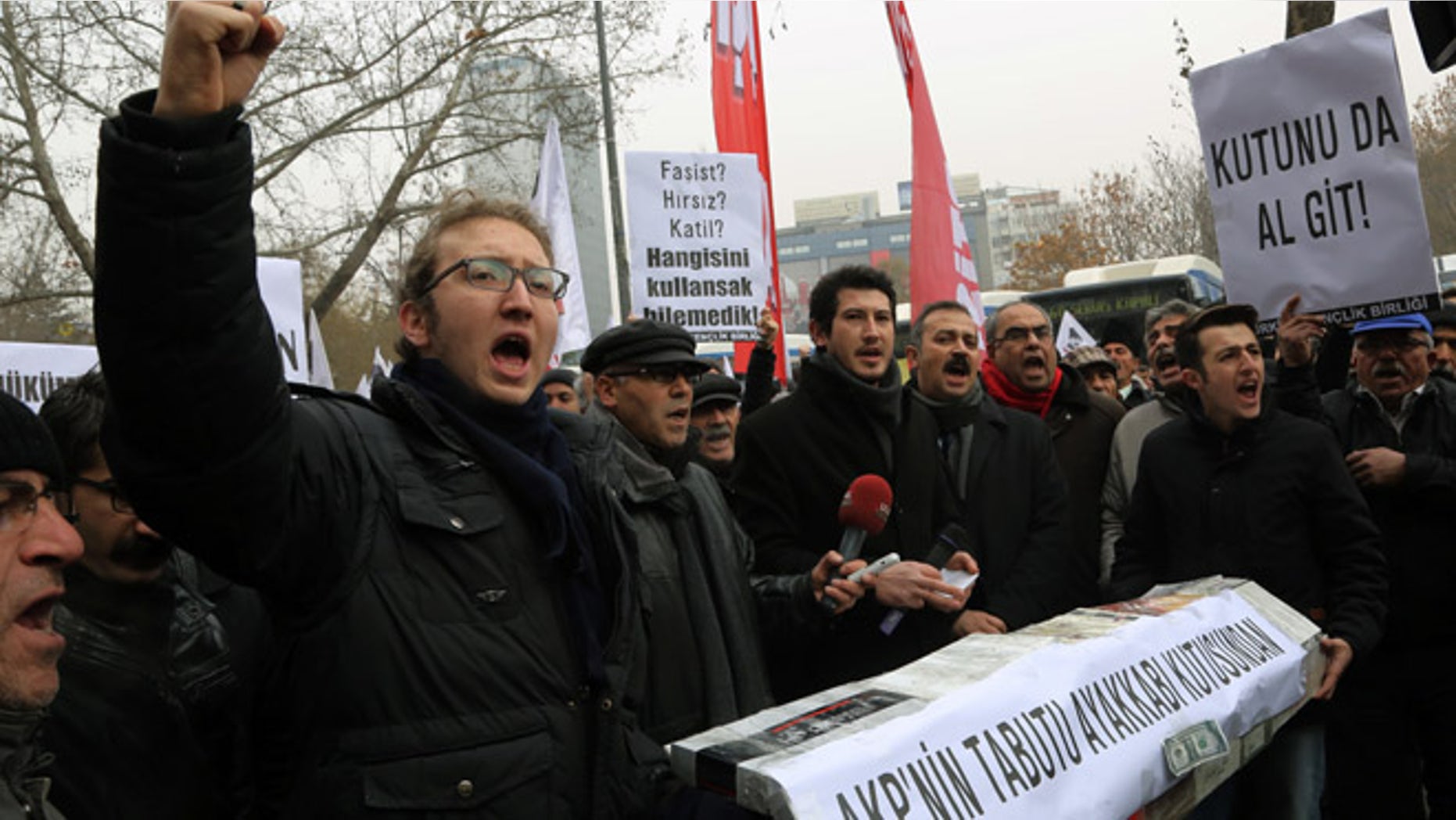 Dec. 21, 2013: People shout anti-government slogans as they carry a casket made of empty shoe boxes during a protest in Ankara, Turkey.