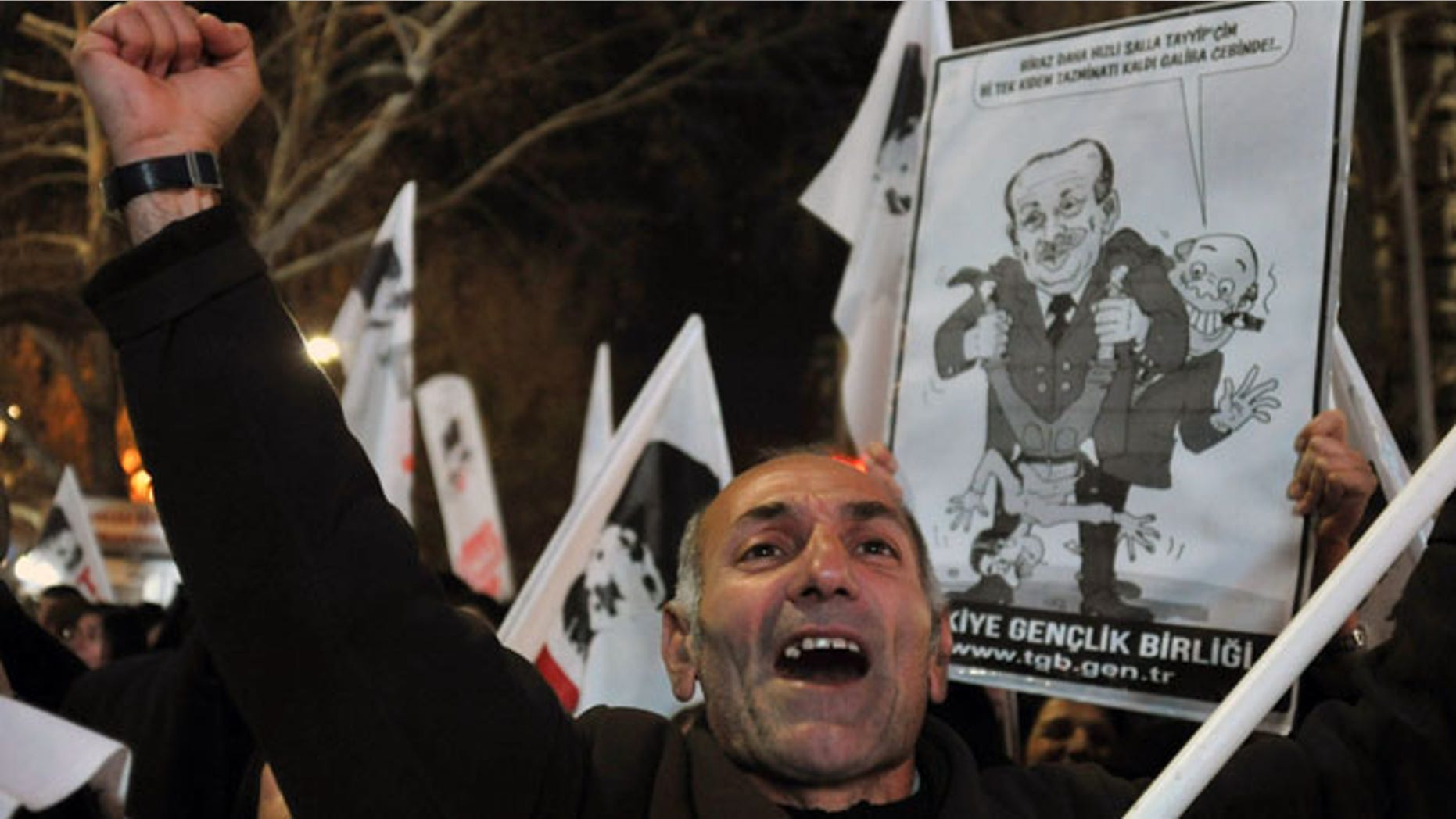 Dec. 27, 2013: A protester shouts " catch the thief!.."as several hundred people call on the government to resign during a protest in Ankara, Turkey.