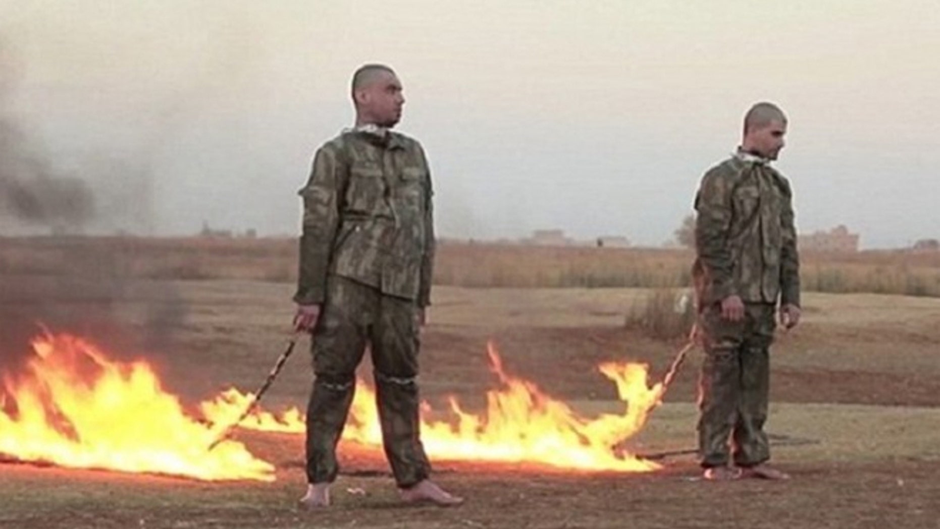 Grim screenshot from ISIS video shows two Turkish soldiers moments before they were burned alive.