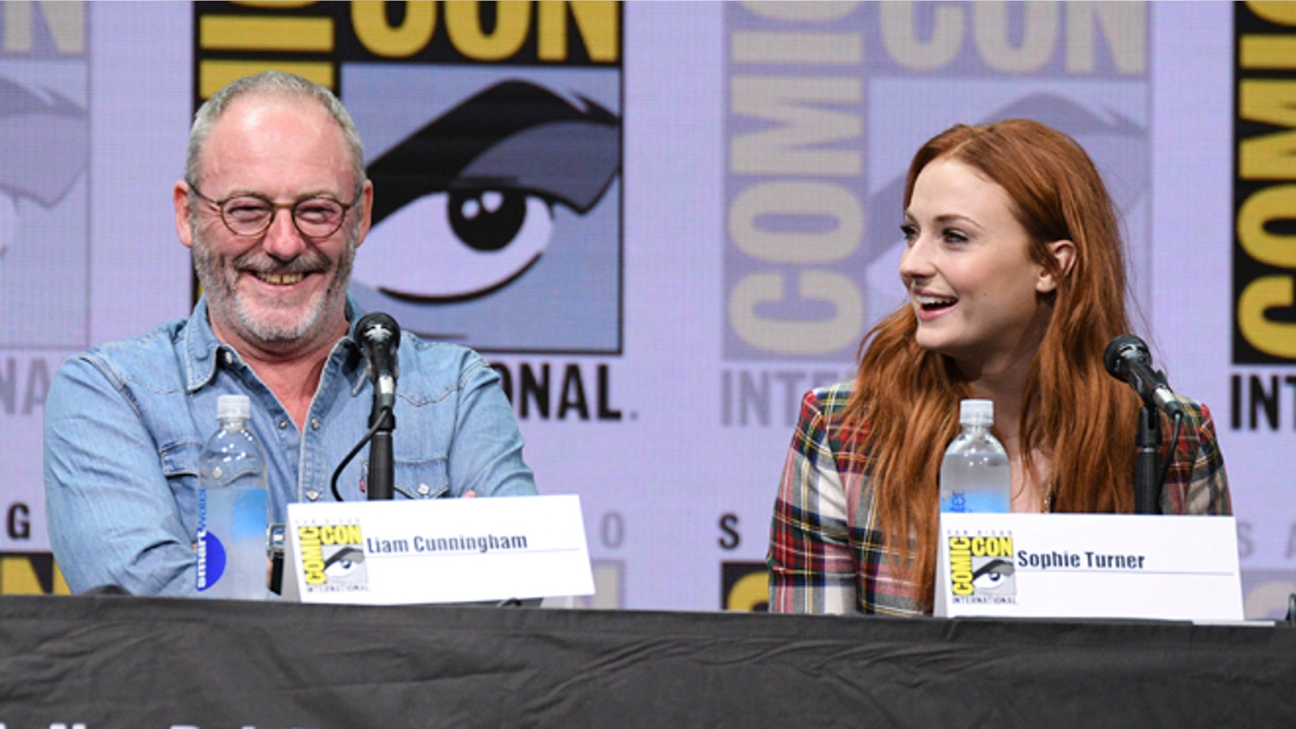 Liam Cunningham and Sophie Turner attend the "Game of Thrones" panel at Comic-Con.