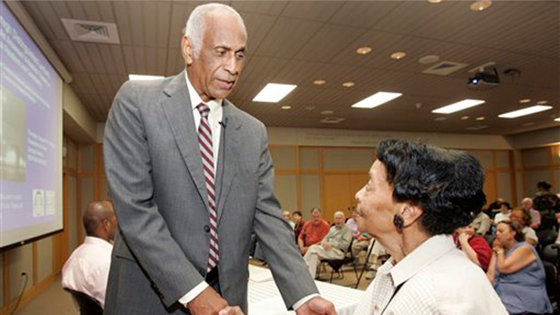 Aug. 1, 2007: In this photo, Milton Crenchaw, who was a member of the first all-black unit in the Army Air Corps during World War II known as the Tuskegee Airmen, left, speaks with Thessia Dunn before participating in a lecture series at the Butler Center for Arkansas Studies in Little Rock, Ark.