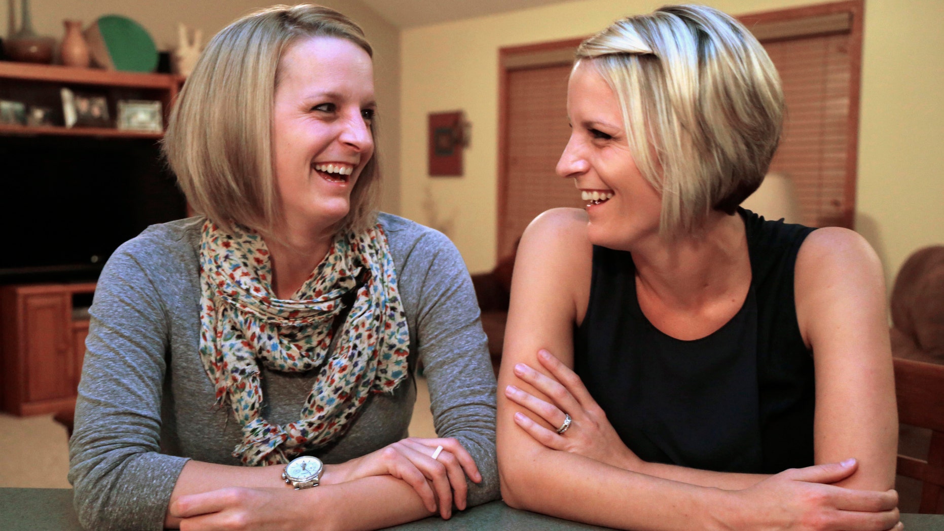 Identical twins Kristen Maurer, left, and Kelly McCarthy. (AP Photo/M. Spencer Green)