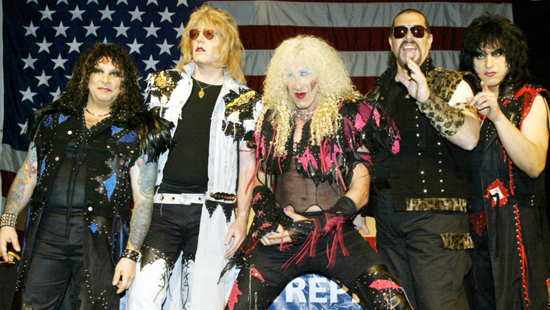 Members of the reunited metal band Twisted Sister, A.J. Pero (L), J.J. French (2nd L), Dee Snider (C), Mark Mendoza (2nd R), and Eddie Ojeda (R) pose for photos before a press conference in New York on April 29, 2003.
