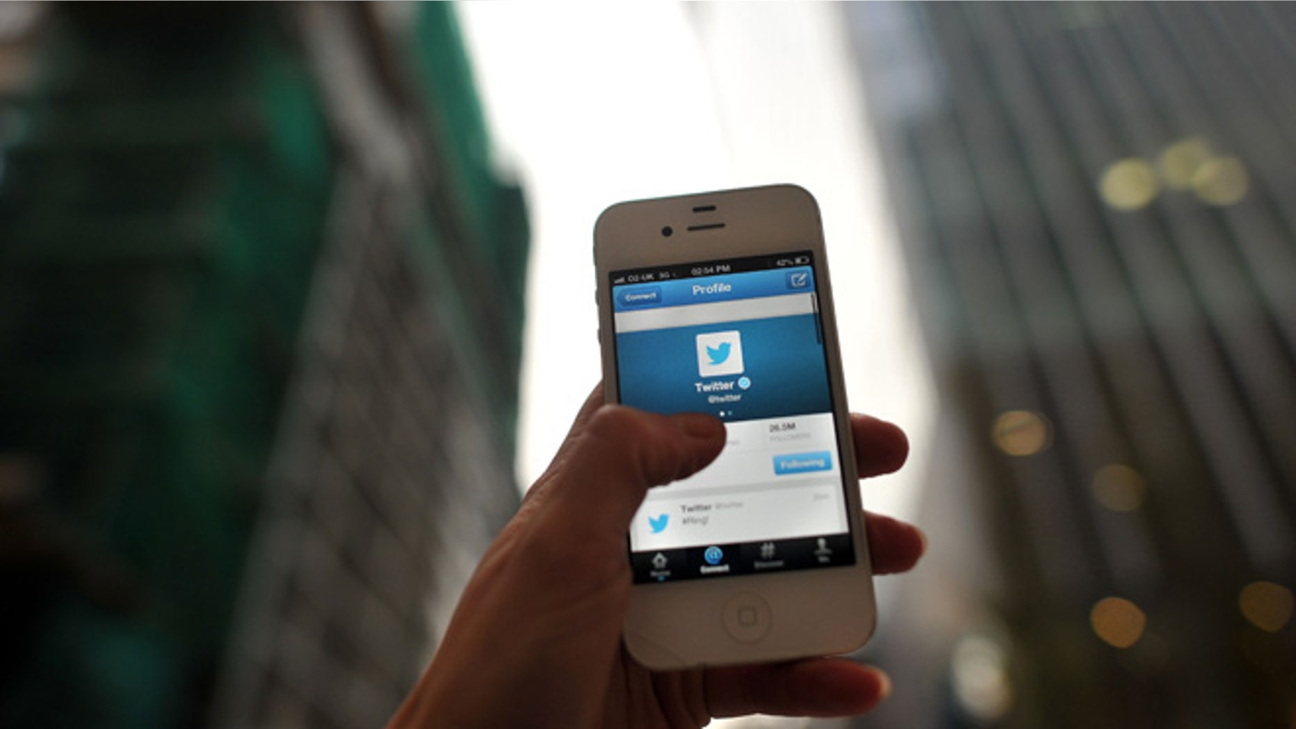 LONDON, ENGLAND - NOVEMBER 07: In this photo illustration, The Twitter logo is displayed on a mobile device as the company announced it's initial public offering and debut on the New York Stock Exchange on November 7, 2013 in London, England. Twitter went public on the NYSE opening at USD 26 per share, valuing the company's worth at an estimated USD 18 billion. (Photo by Bethany Clarke/Getty Images)