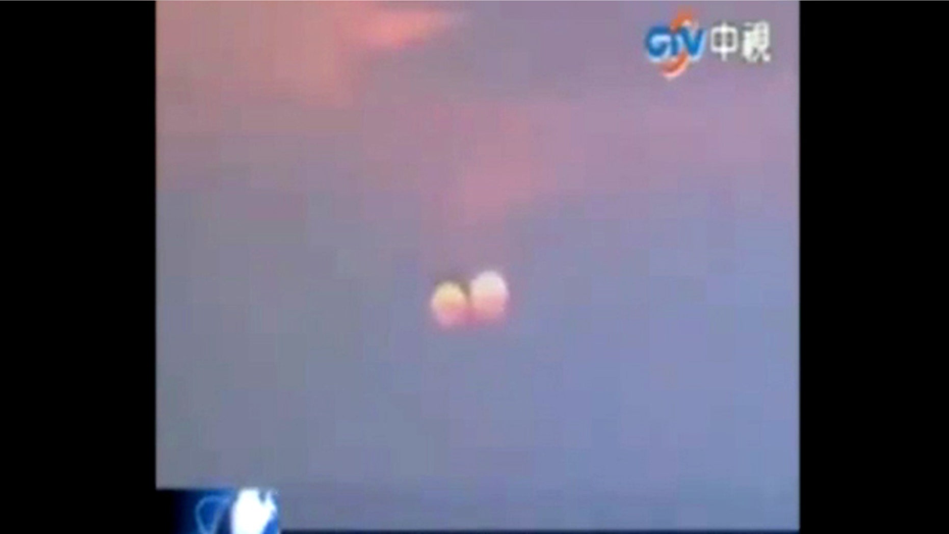 A still from a video that purportedly shows a "two suns" setting in China. One scientists suspects the apparition could be an optical illusion at sunsets, rather than an all-out hoax.