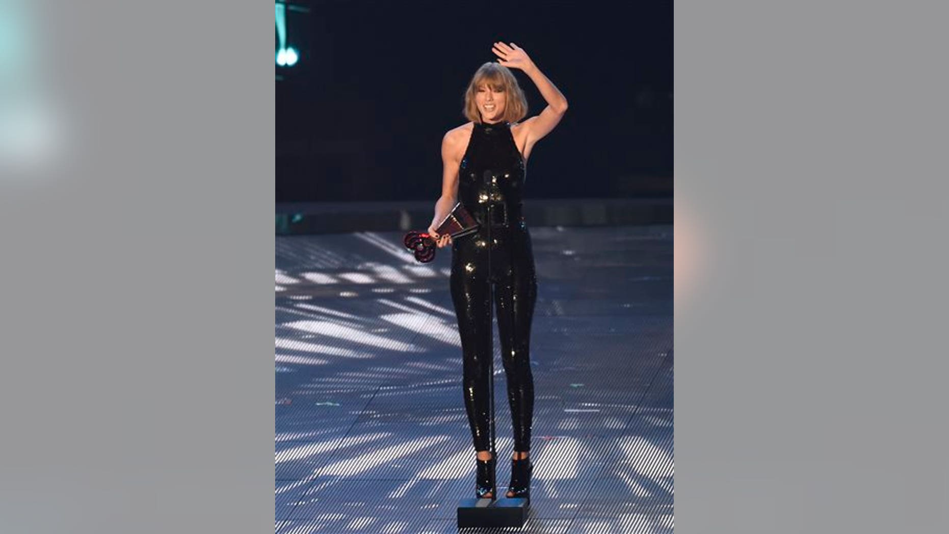 Taylor Swift accepts the award for best tour during the iHeartRadio Music Awards at The Forum on Sunday, April 3, 2016, in Inglewood, Calif. (Photo by Chris Pizzellol/Invision/AP)